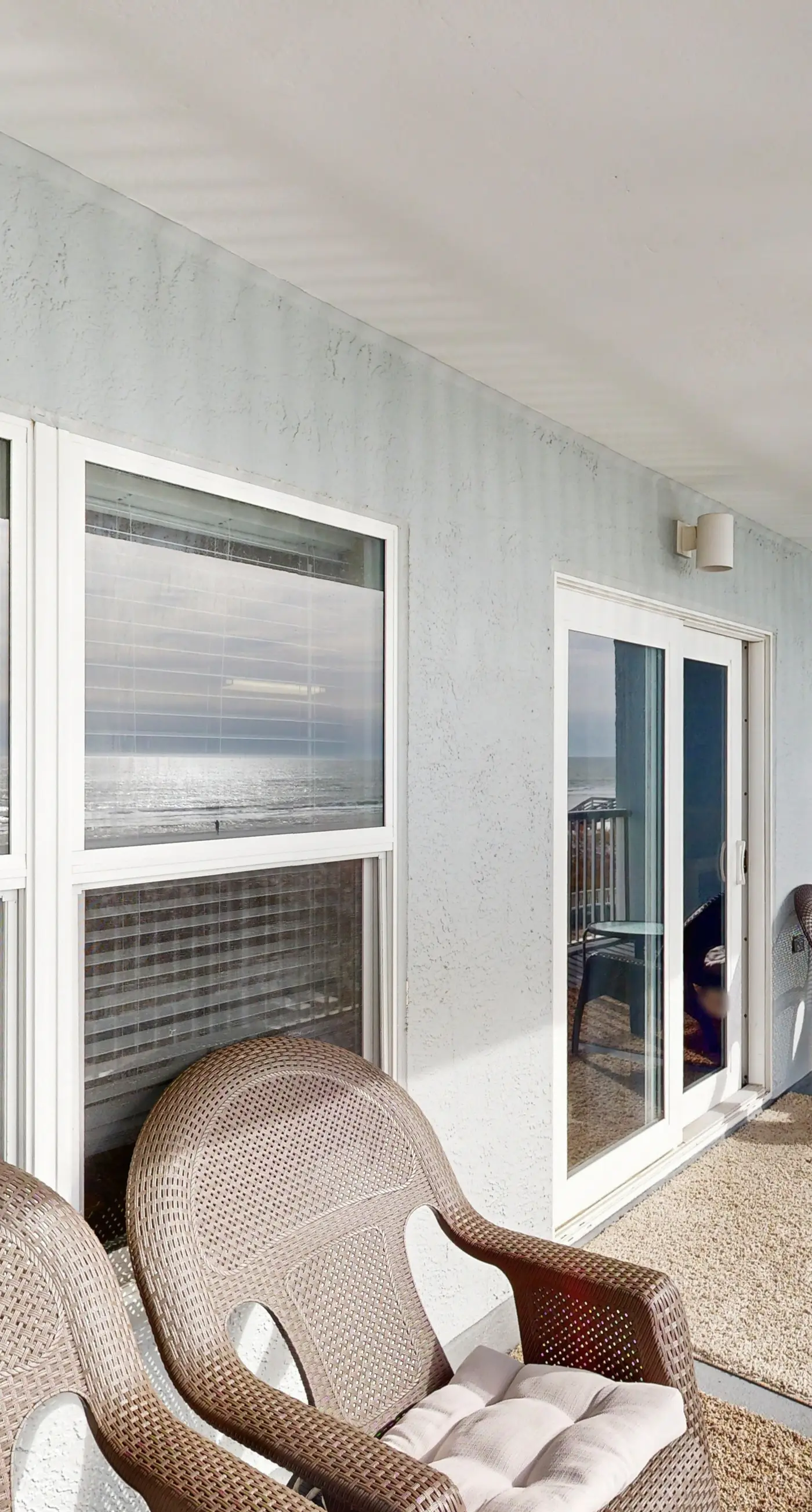 Third floor oceanfront condo with ocean view, pool access, and central AC