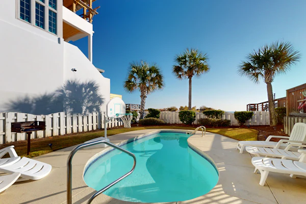 Gulf-front house near golf with pool, ocean views, beach access, & balcony