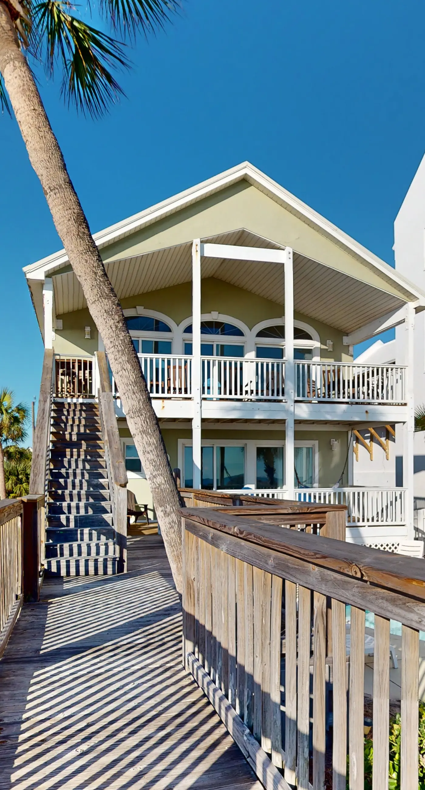 Gulf-front house near golf with pool, ocean views, beach access, & balcony