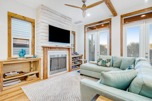 Coastal retreat steps from pool with furnished balcony, bikes