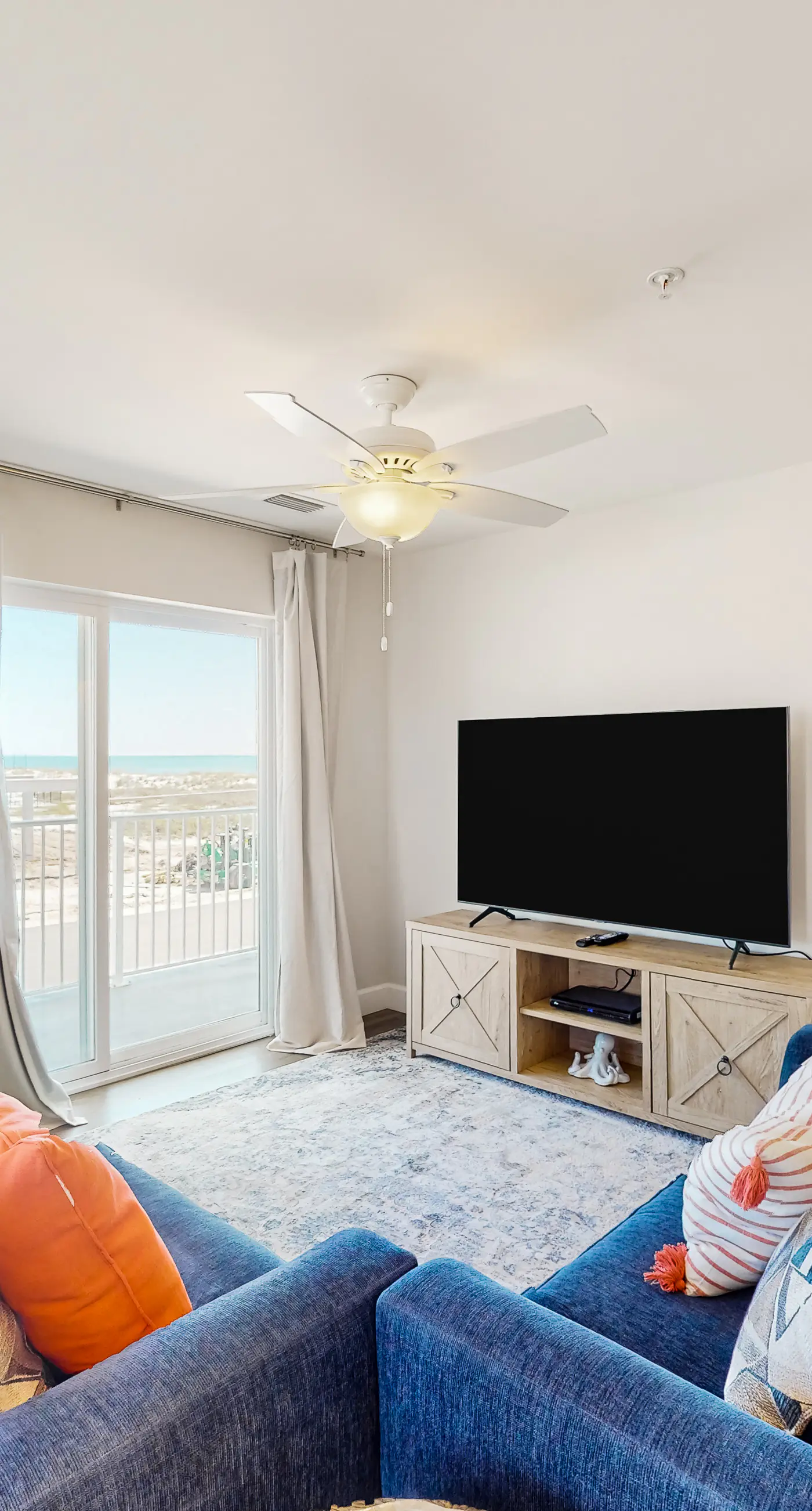 2nd-floor ocean-view condo with balcony, washer/dryer, & AC - close to the beach