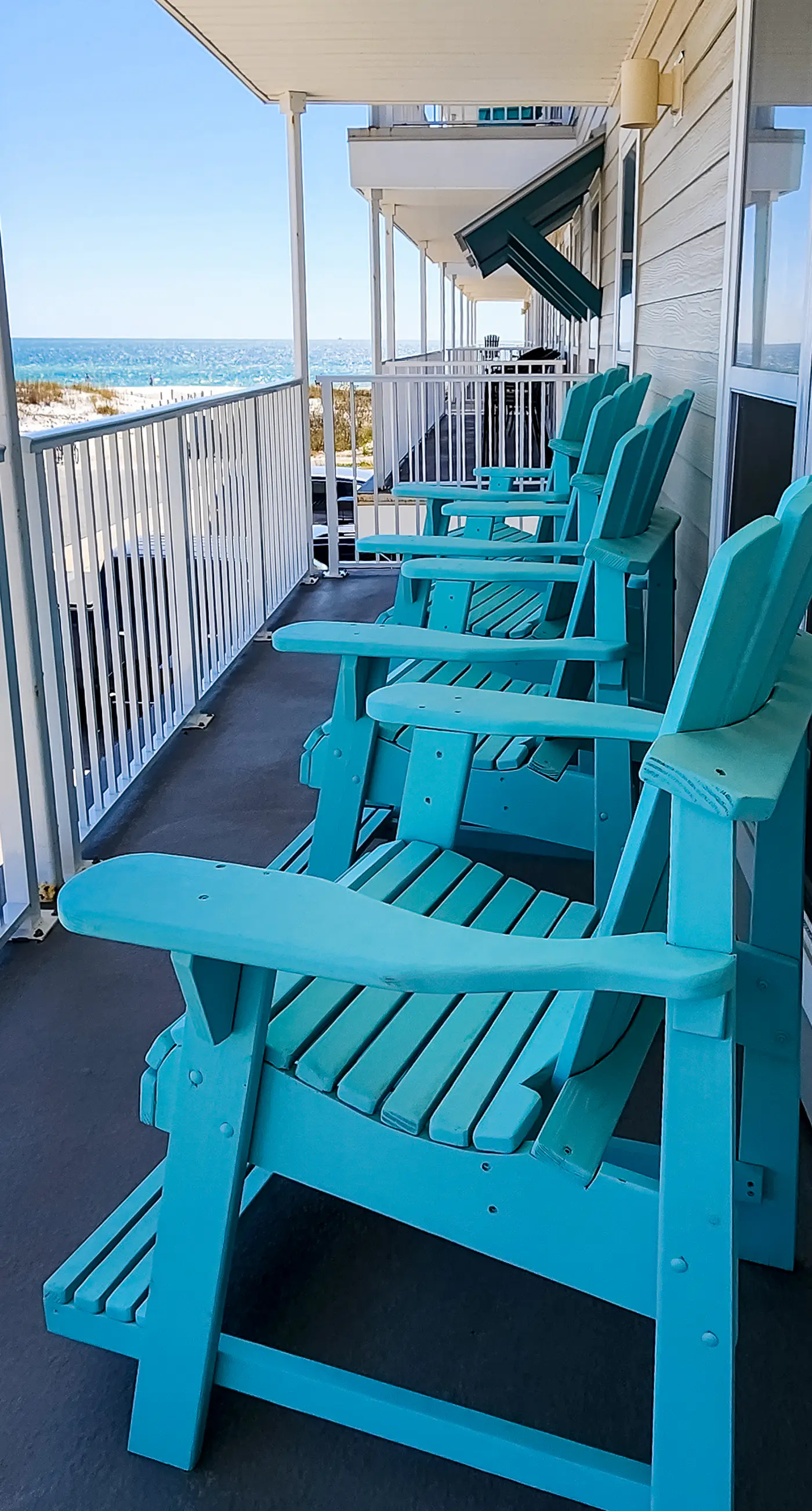 2nd-floor ocean-view condo with balcony, washer/dryer, & AC - close to the beach