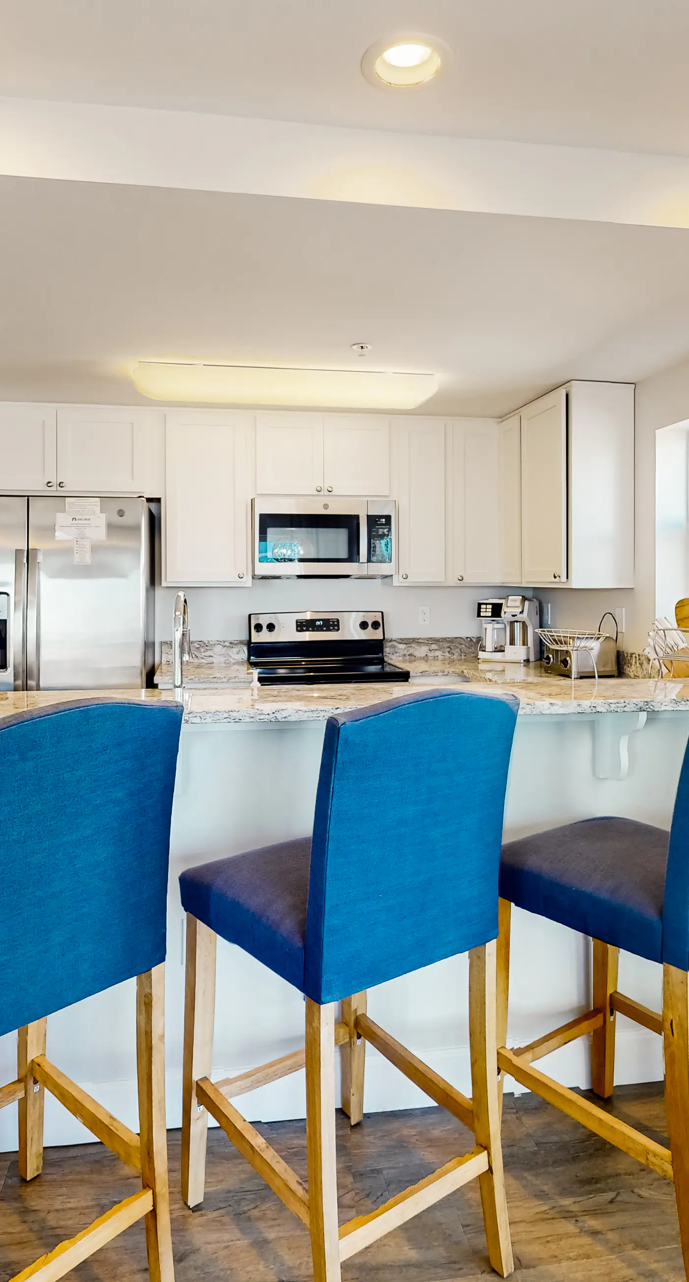 2nd-floor ocean-view condo with balcony, washer/dryer, & AC - close to the beach