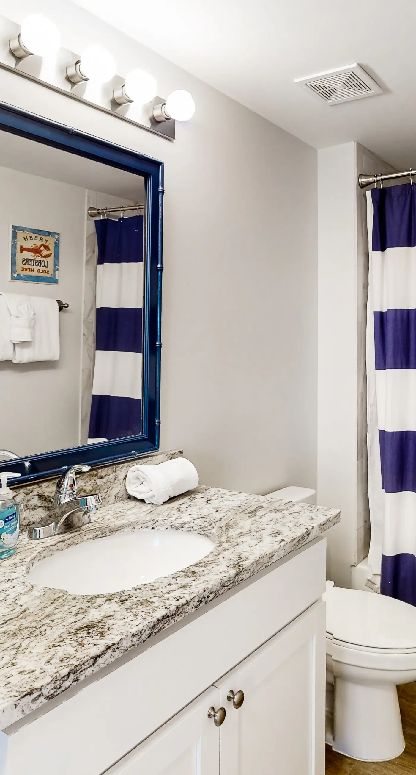 2nd-floor ocean-view condo with balcony, washer/dryer, & AC - close to the beach