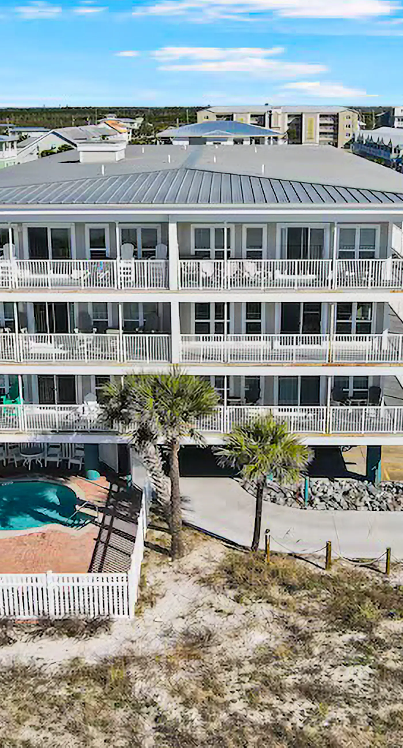 2nd-floor ocean-view condo with balcony, washer/dryer, & AC - close to the beach
