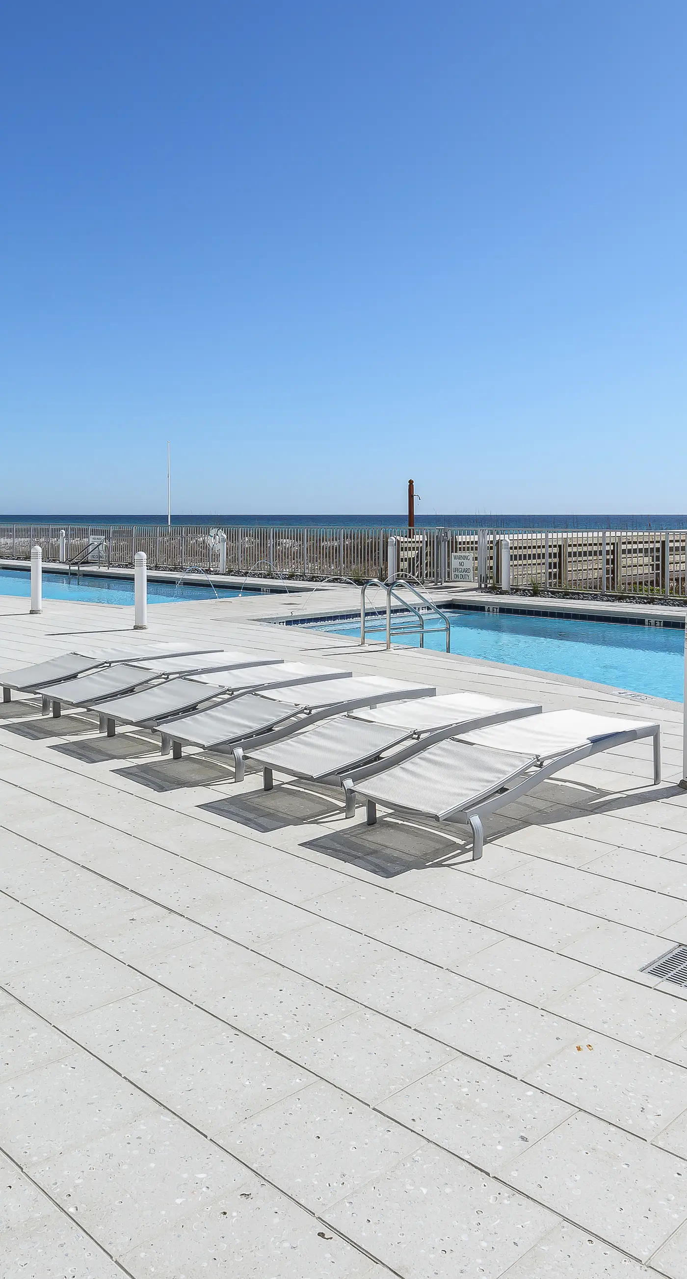 Blu 105 - Gulf-front condo with pools and seasonal beach service in a gated community