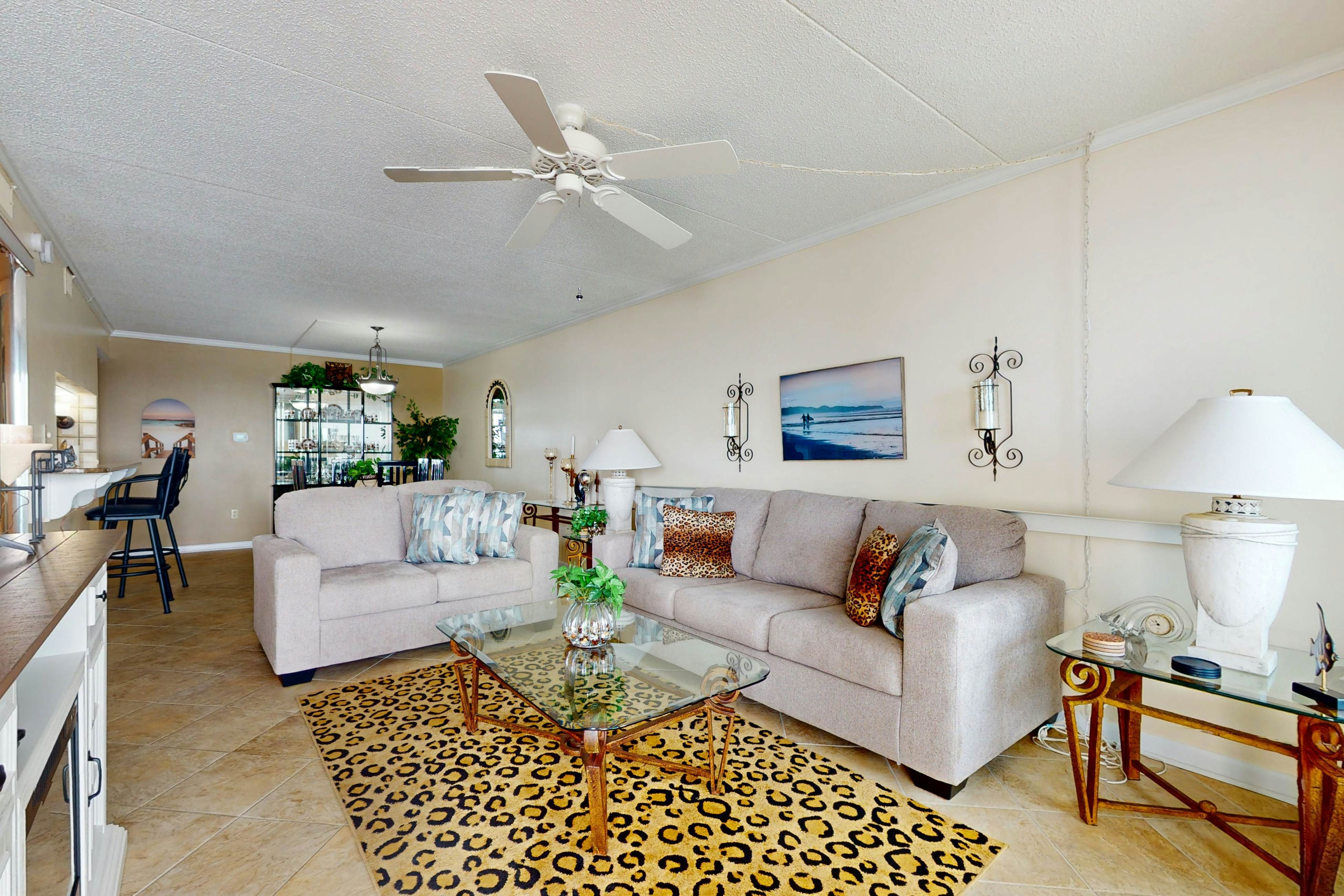 Gulf-front condo with views, beach access, pool, balcony, & fitness room