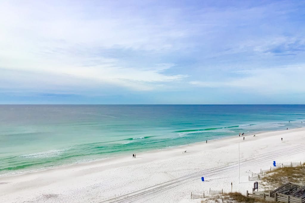 Gulf-front condo with views, beach access, pool, balcony, & fitness room