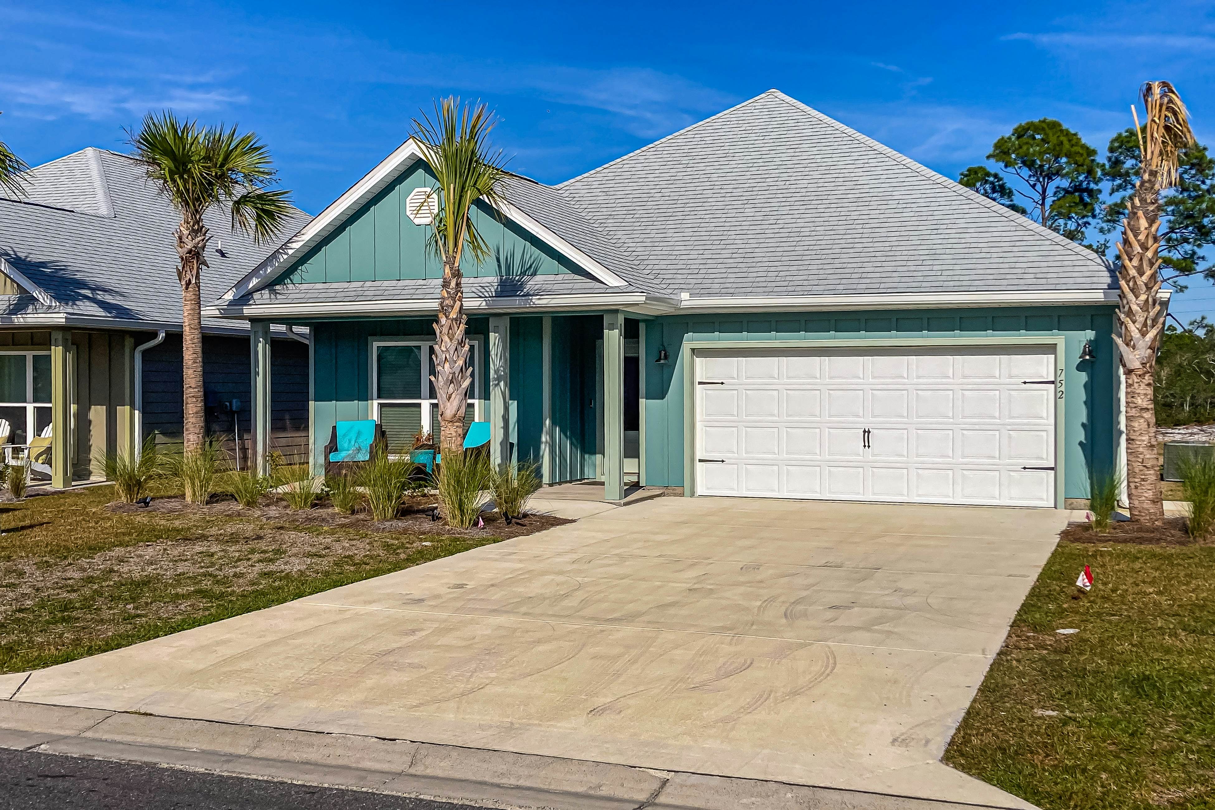 Snowbird-friendly resort home with pool, golf cart, patio, bikes, beach access