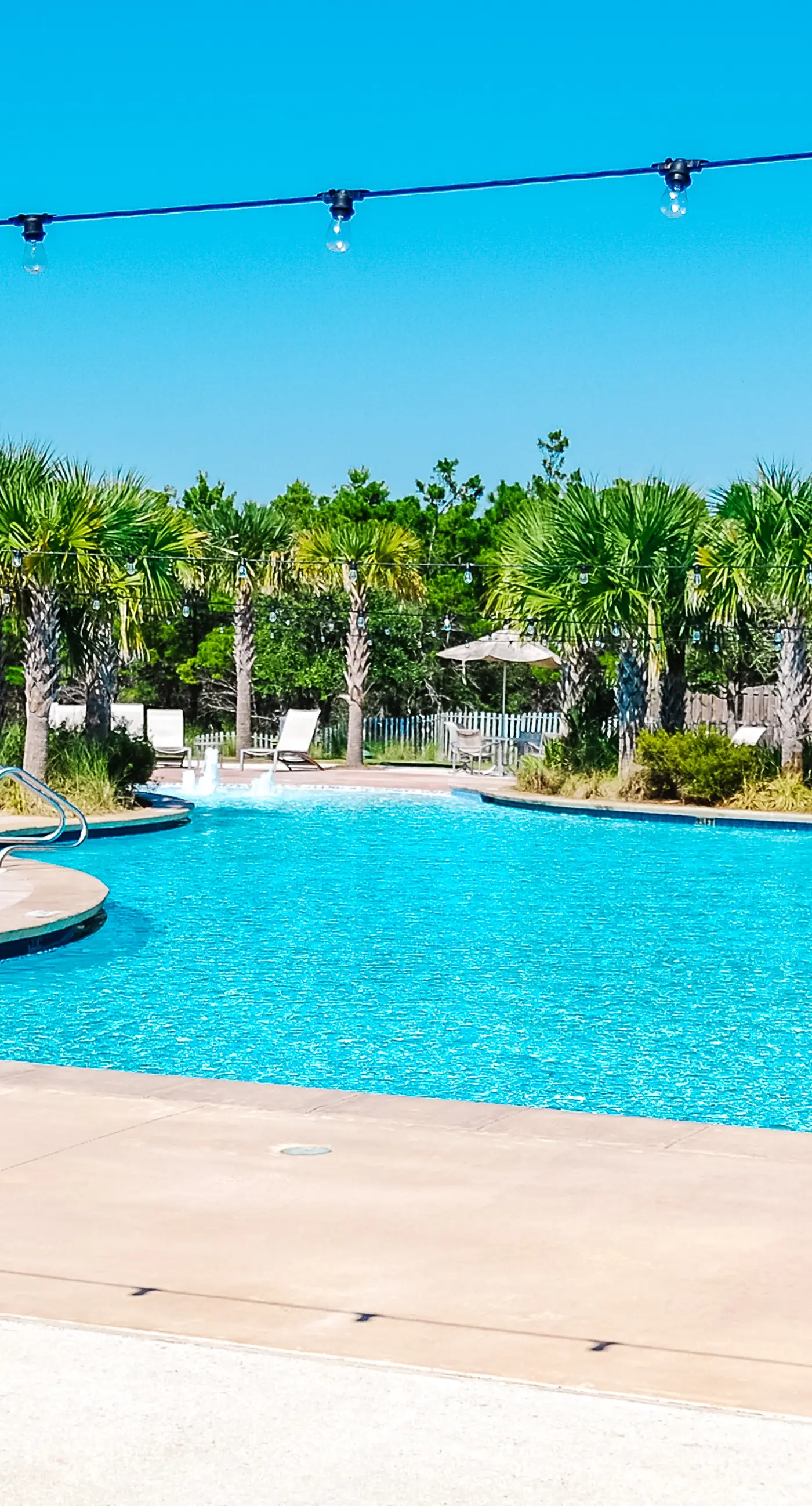 Snowbird-friendly resort home with pool, golf cart, patio, bikes, beach access