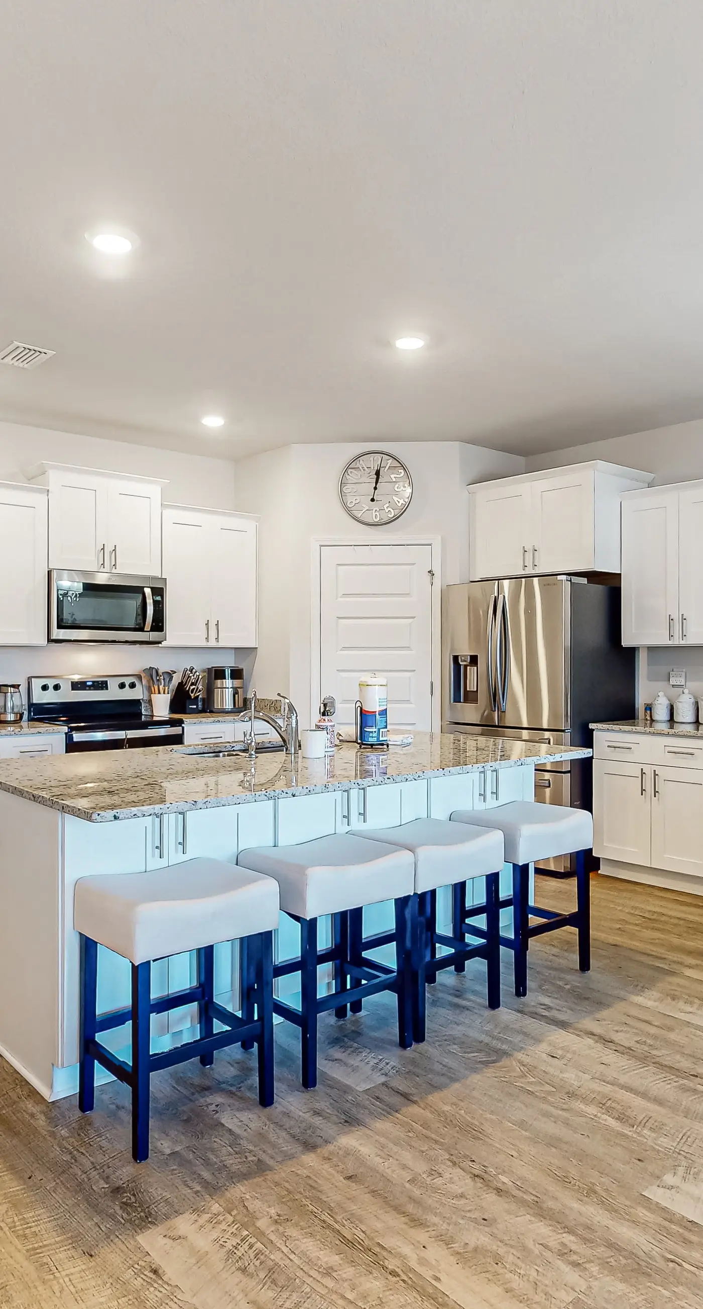 Snowbird-friendly resort home with pool, golf cart, patio, bikes, beach access