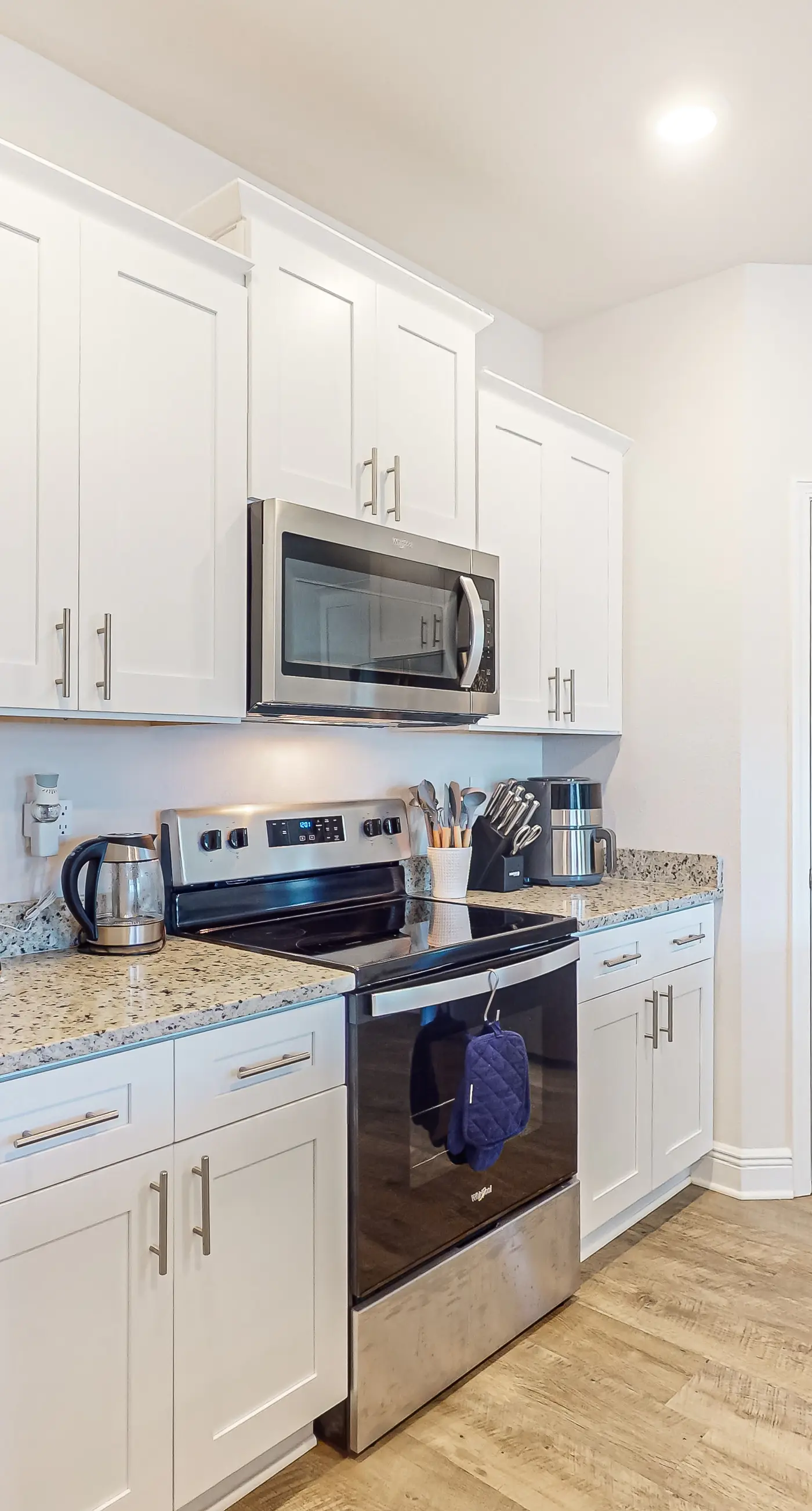 Snowbird-friendly resort home with pool, golf cart, patio, bikes, beach access