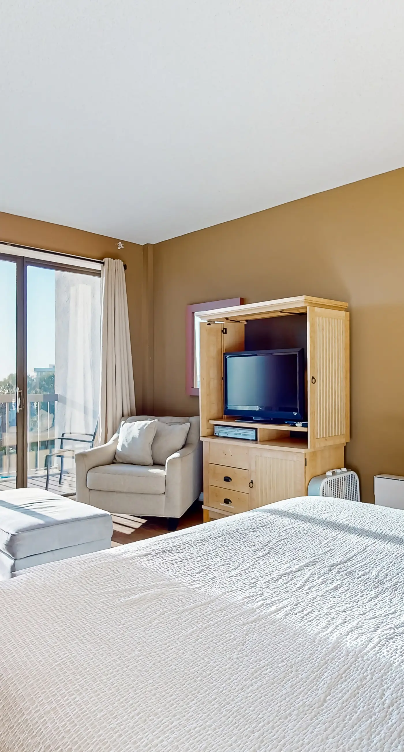 Inviting bayfront suite with water views, picnic area & pool
