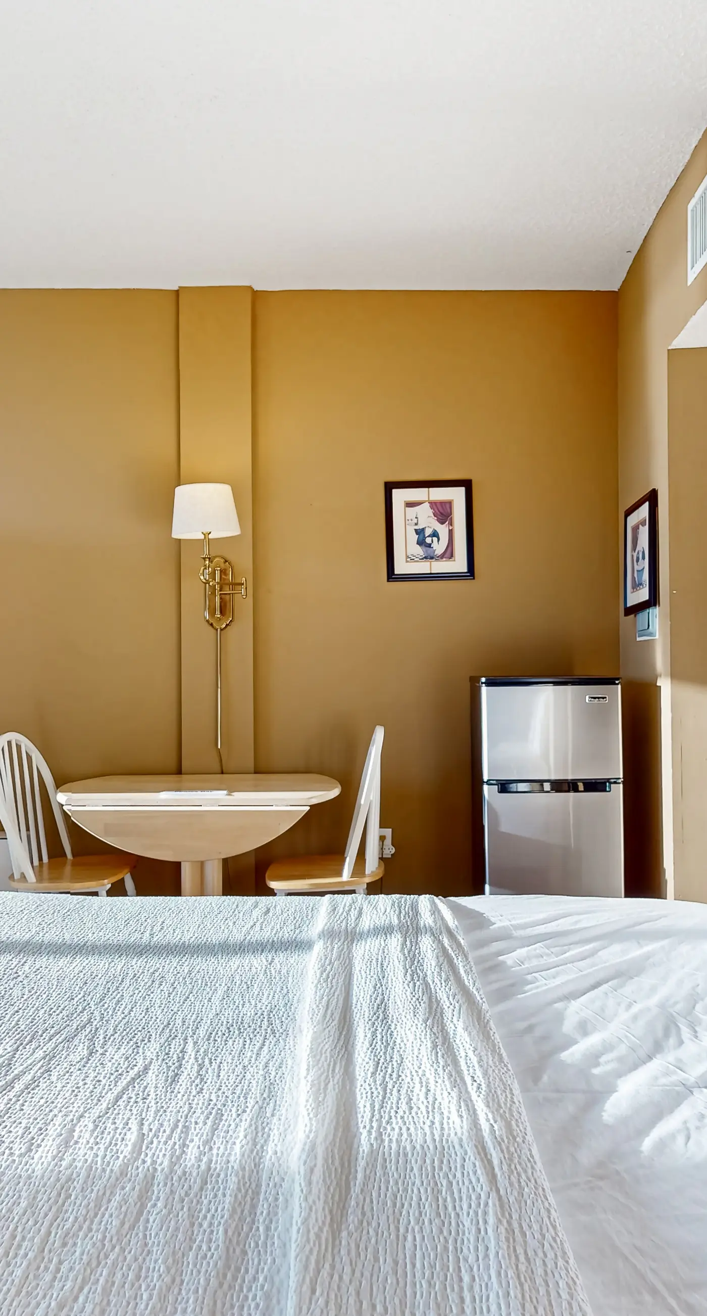 Inviting bayfront suite with water views, picnic area & pool