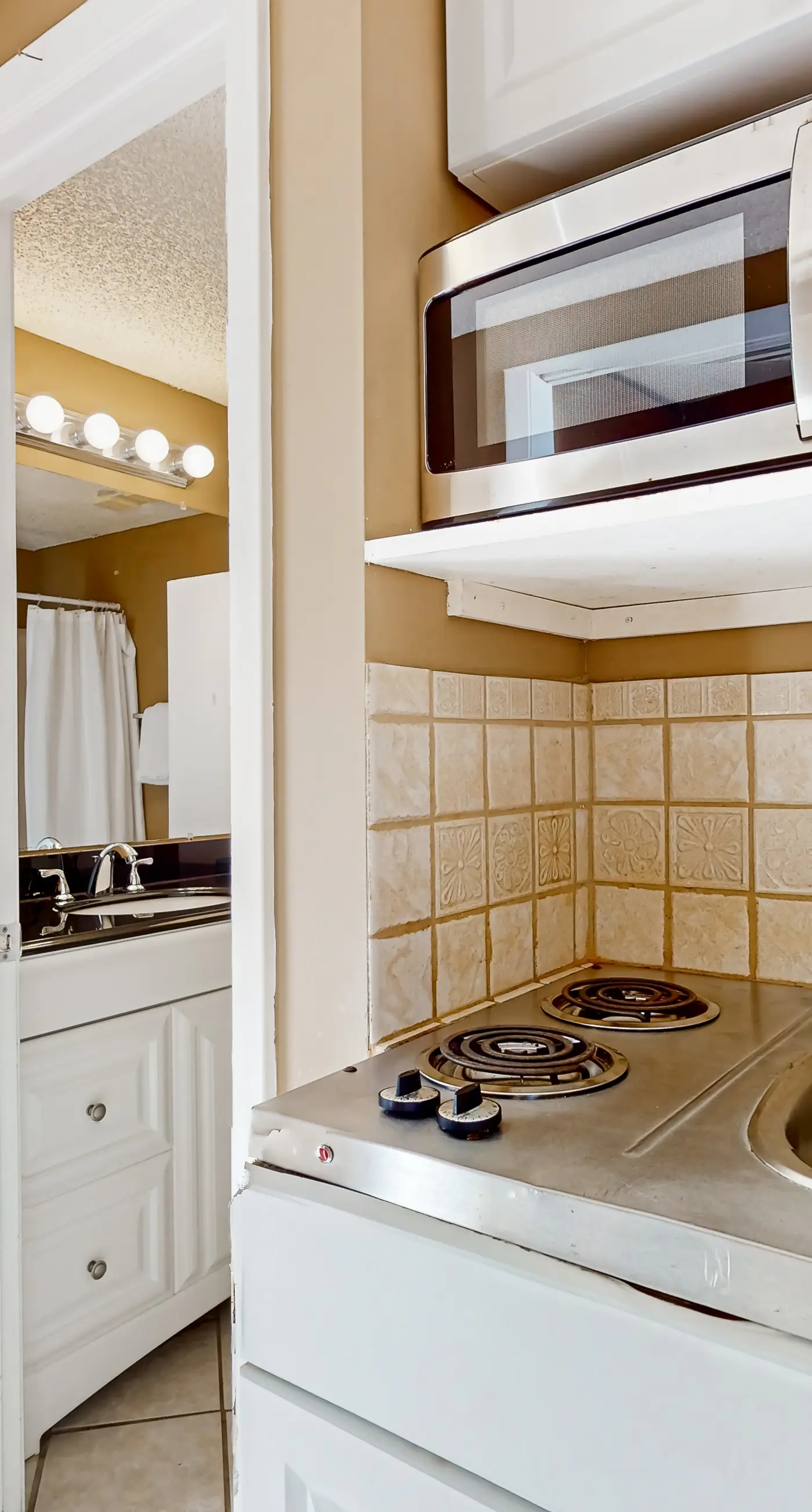 Inviting bayfront suite with water views, picnic area & pool