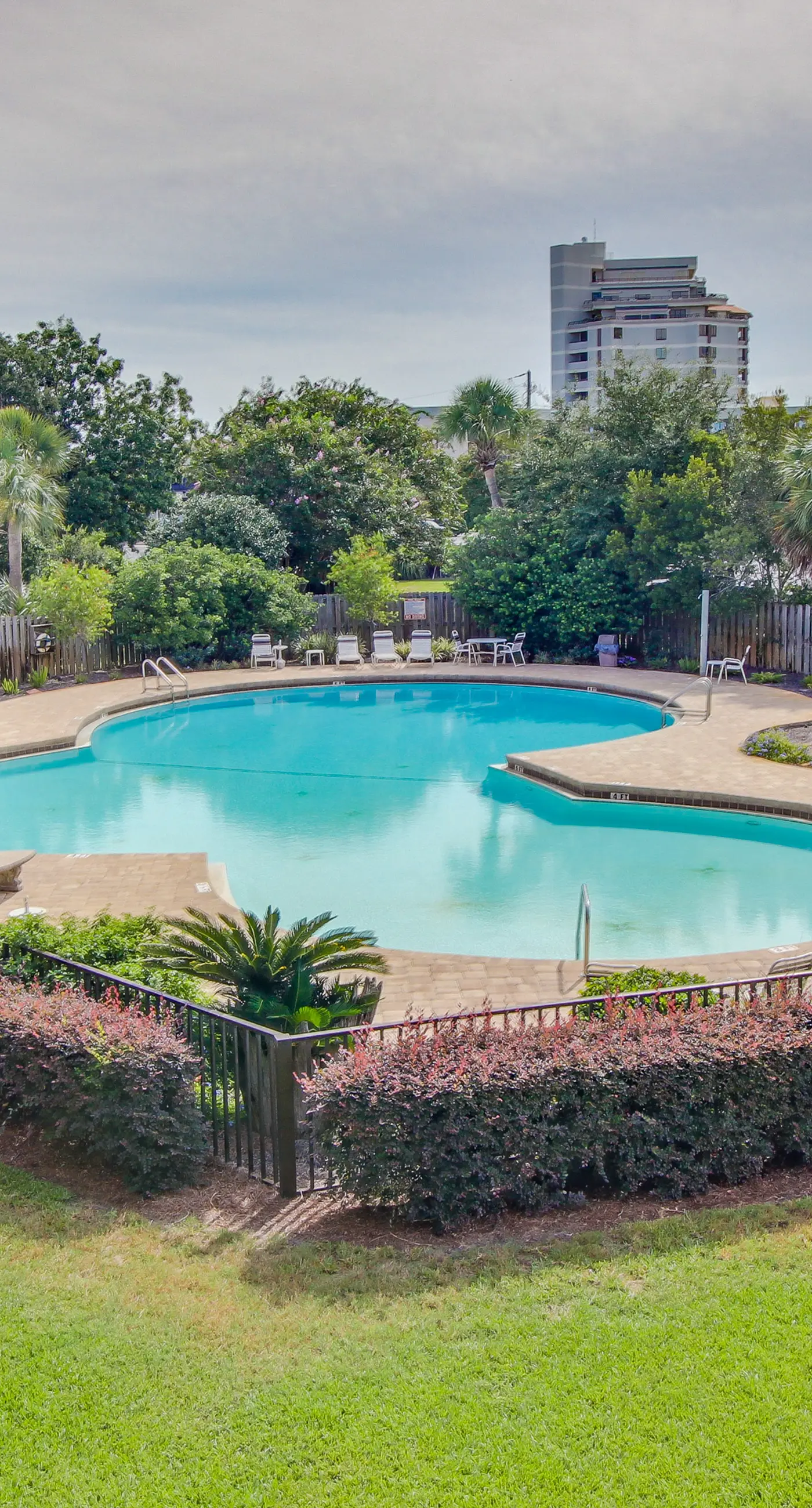 Inviting bayfront suite with water views, picnic area & pool