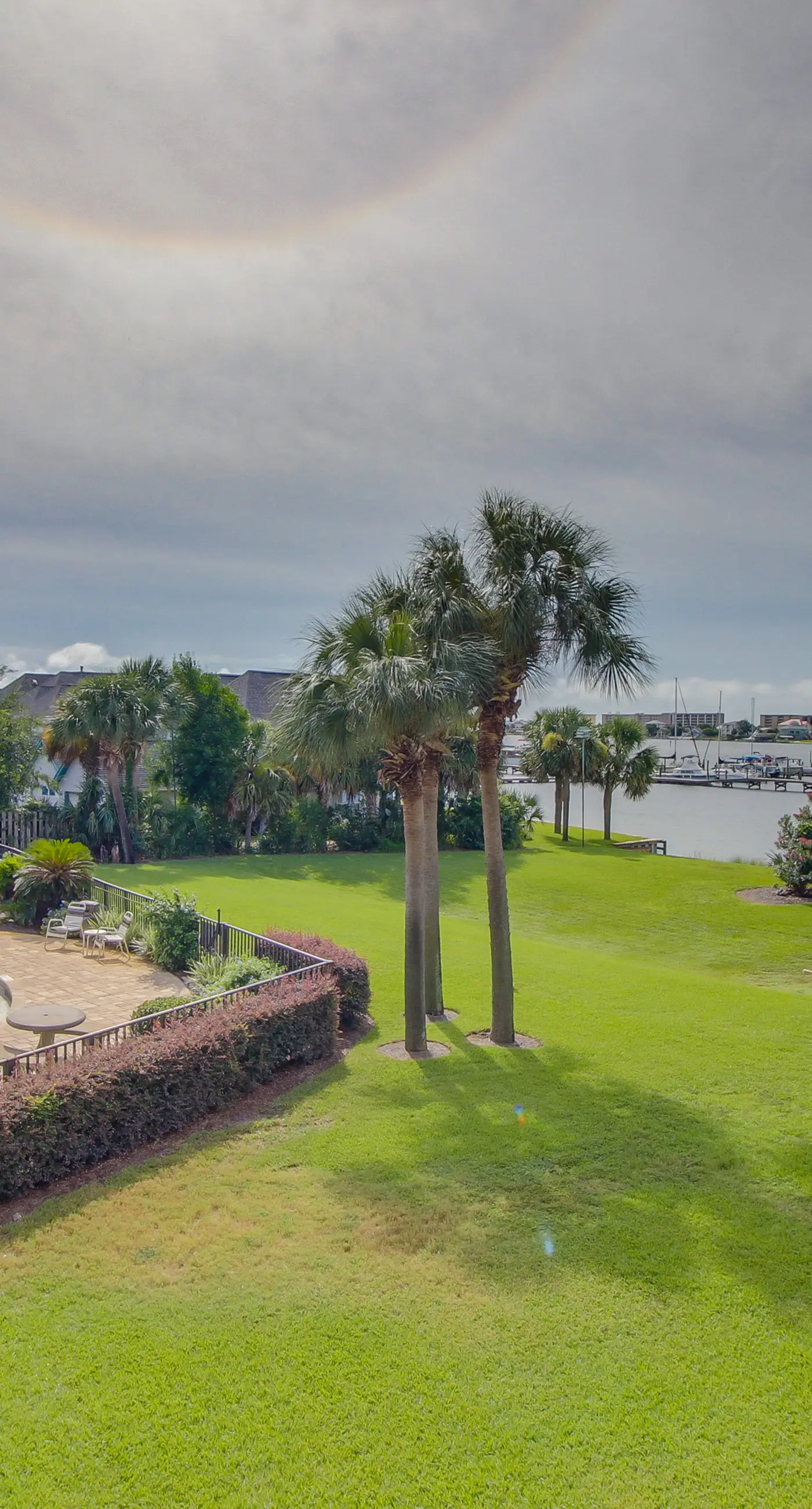 Inviting bayfront suite with water views, picnic area & pool
