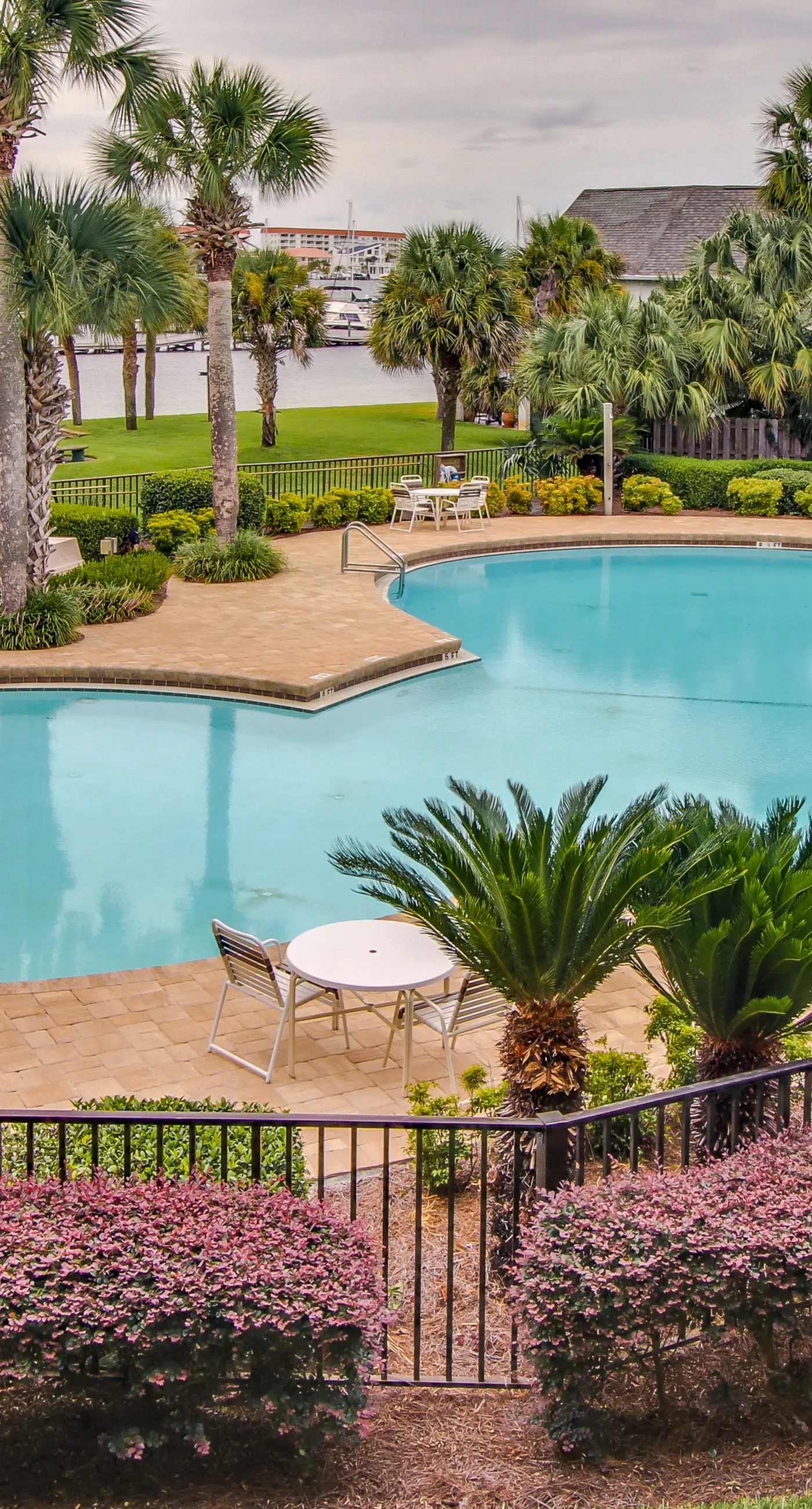 Inviting bayfront suite with water views, picnic area & pool