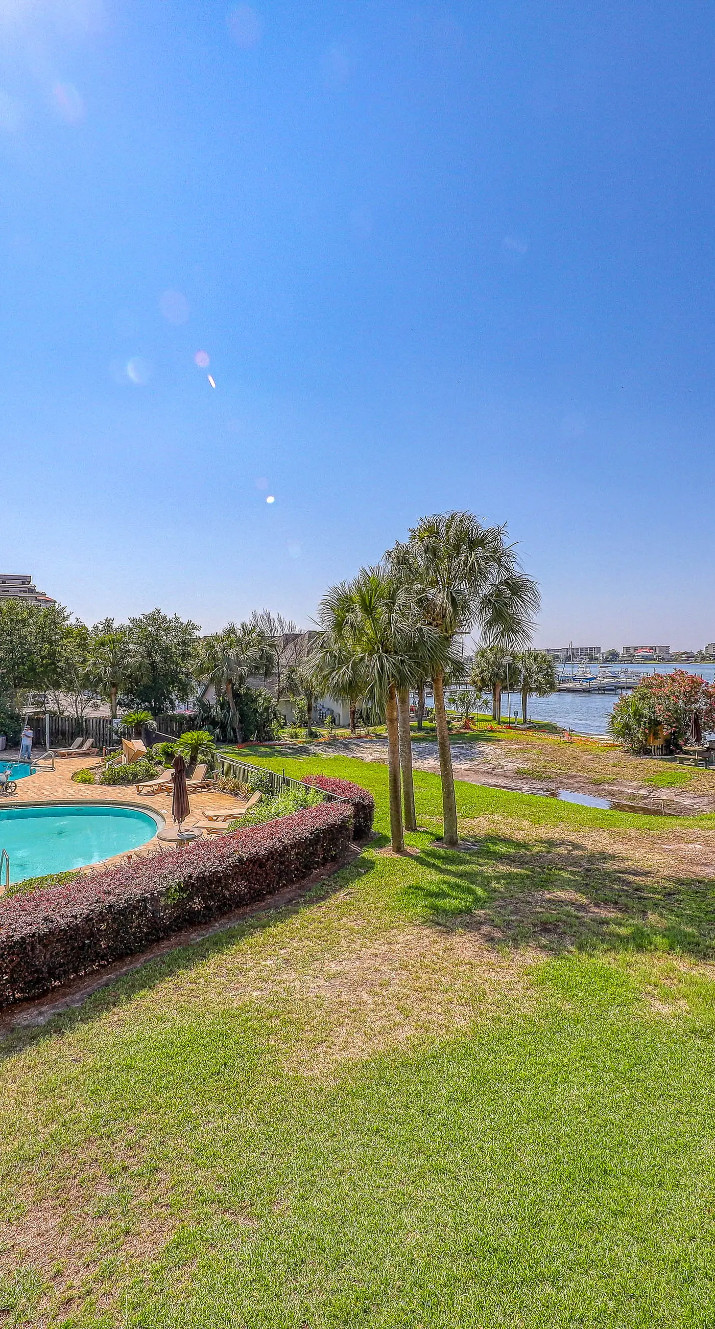 Inviting bayfront suite with water views, picnic area & pool