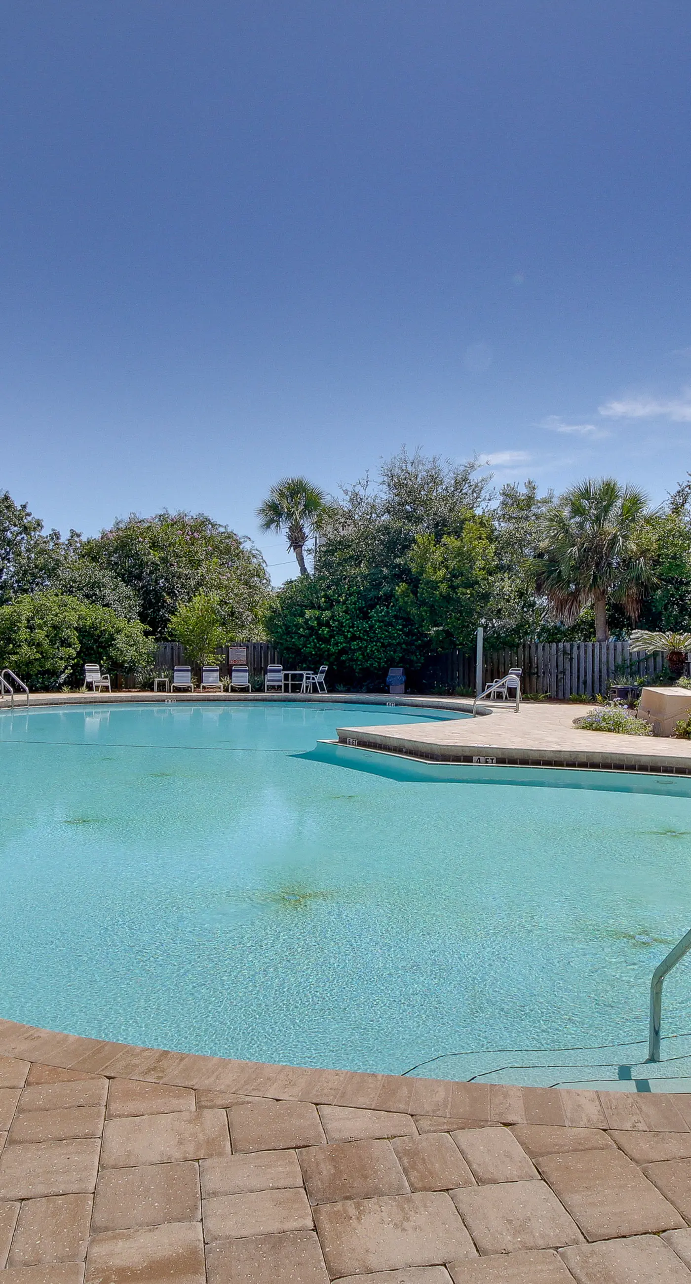 Inviting bayfront suite with water views, picnic area & pool