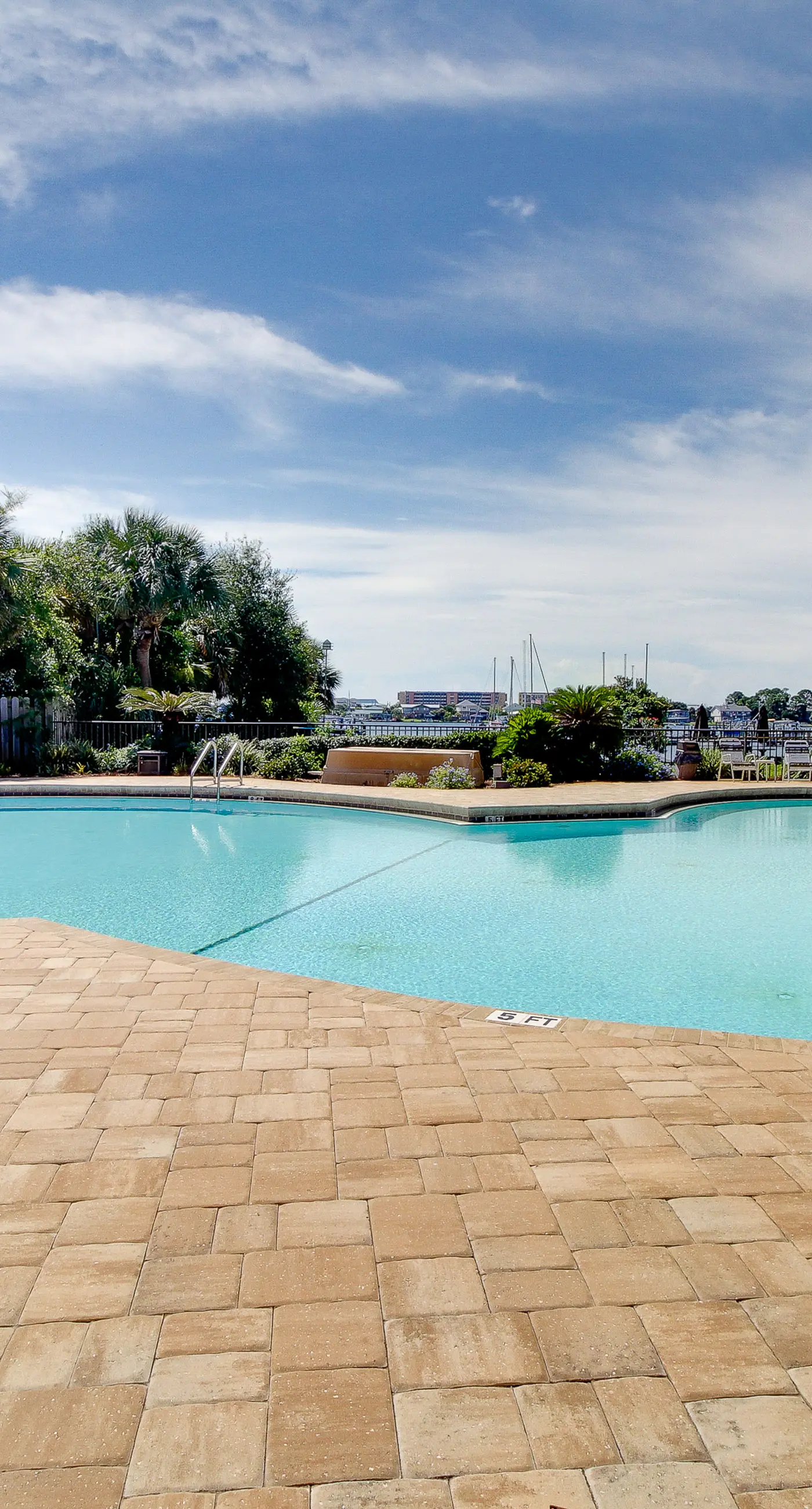 Inviting bayfront suite with water views, picnic area & pool