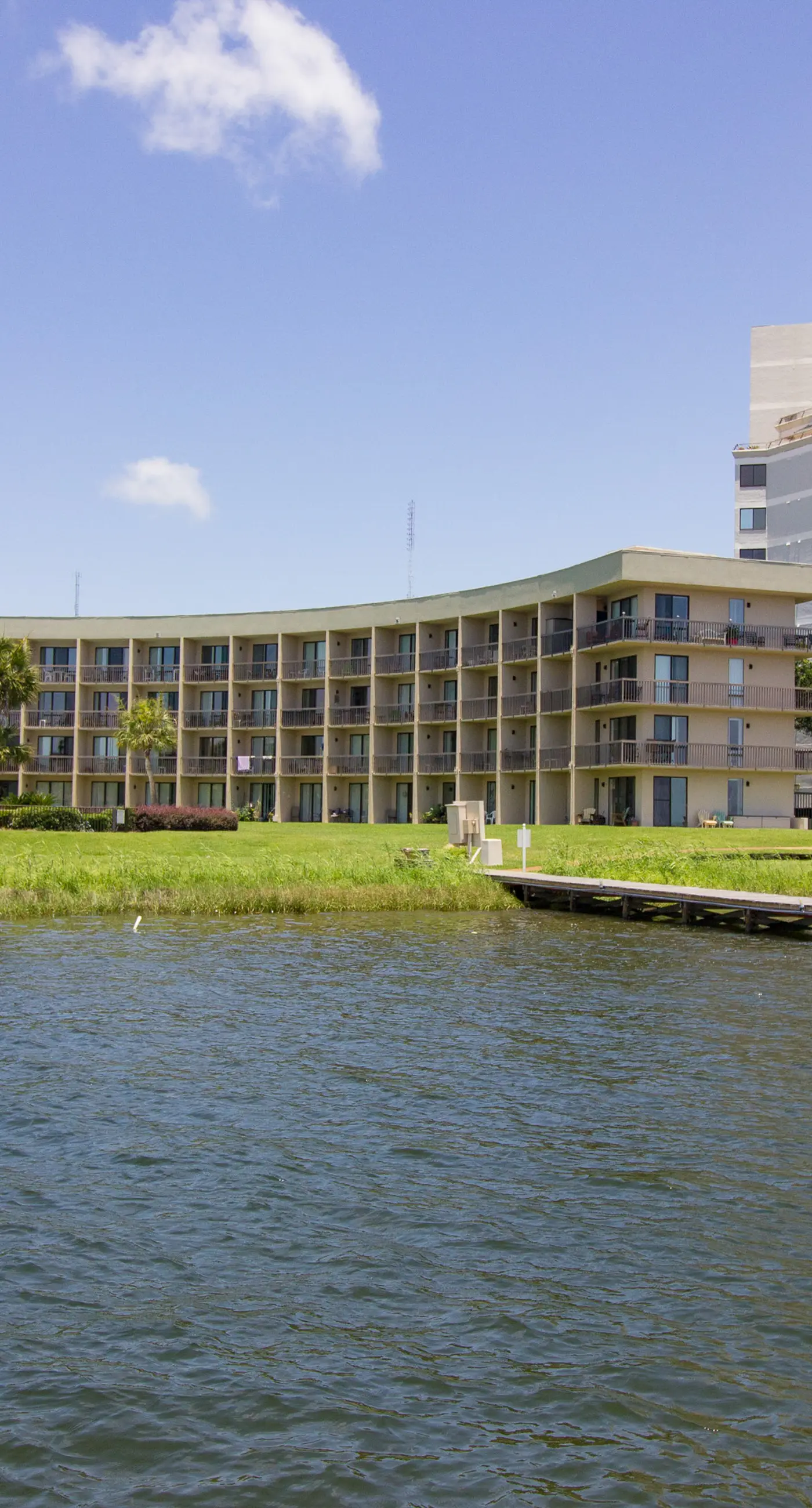 Inviting bayfront suite with water views, picnic area & pool