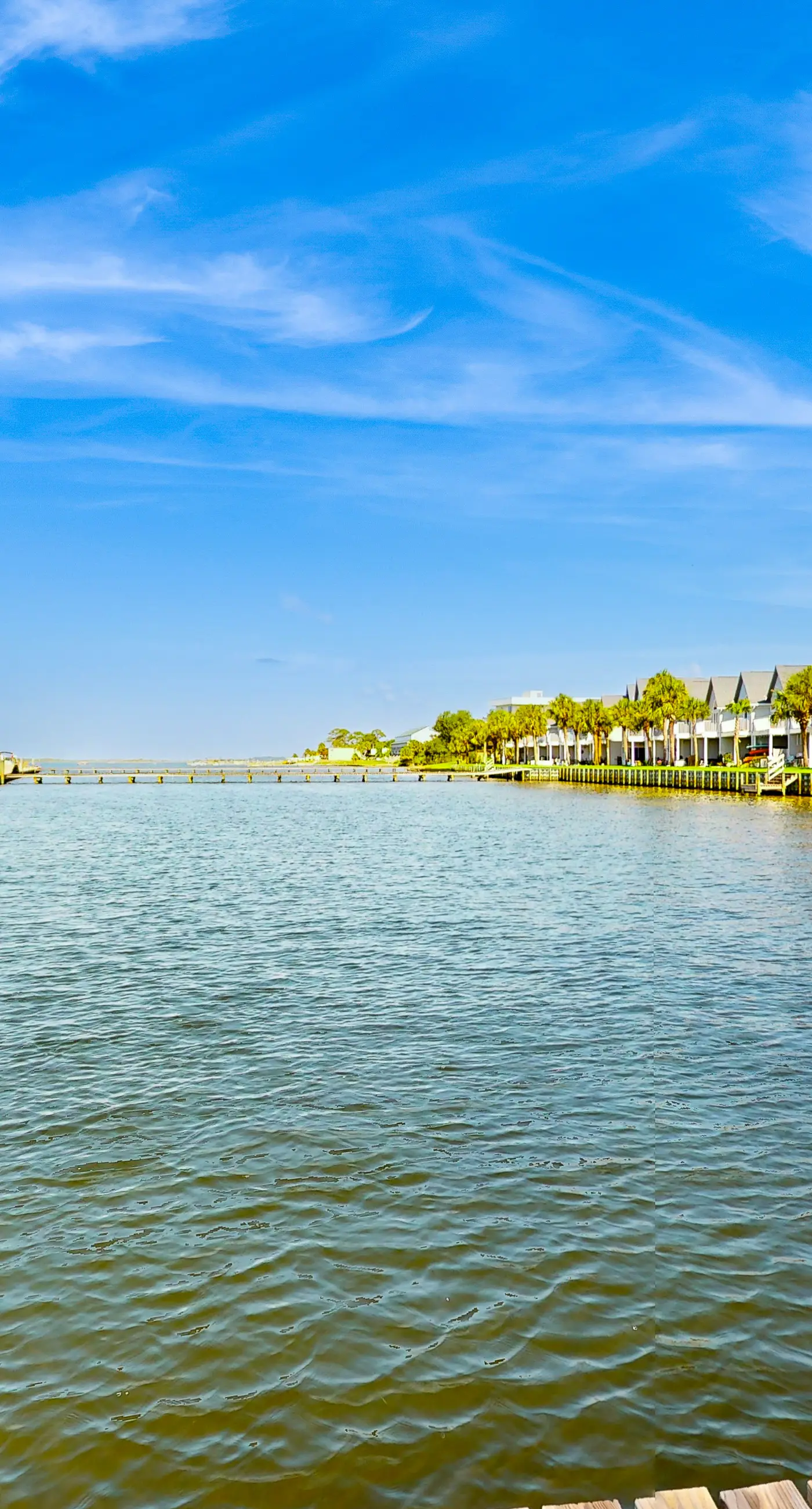 Inviting bayfront suite with water views, picnic area & pool