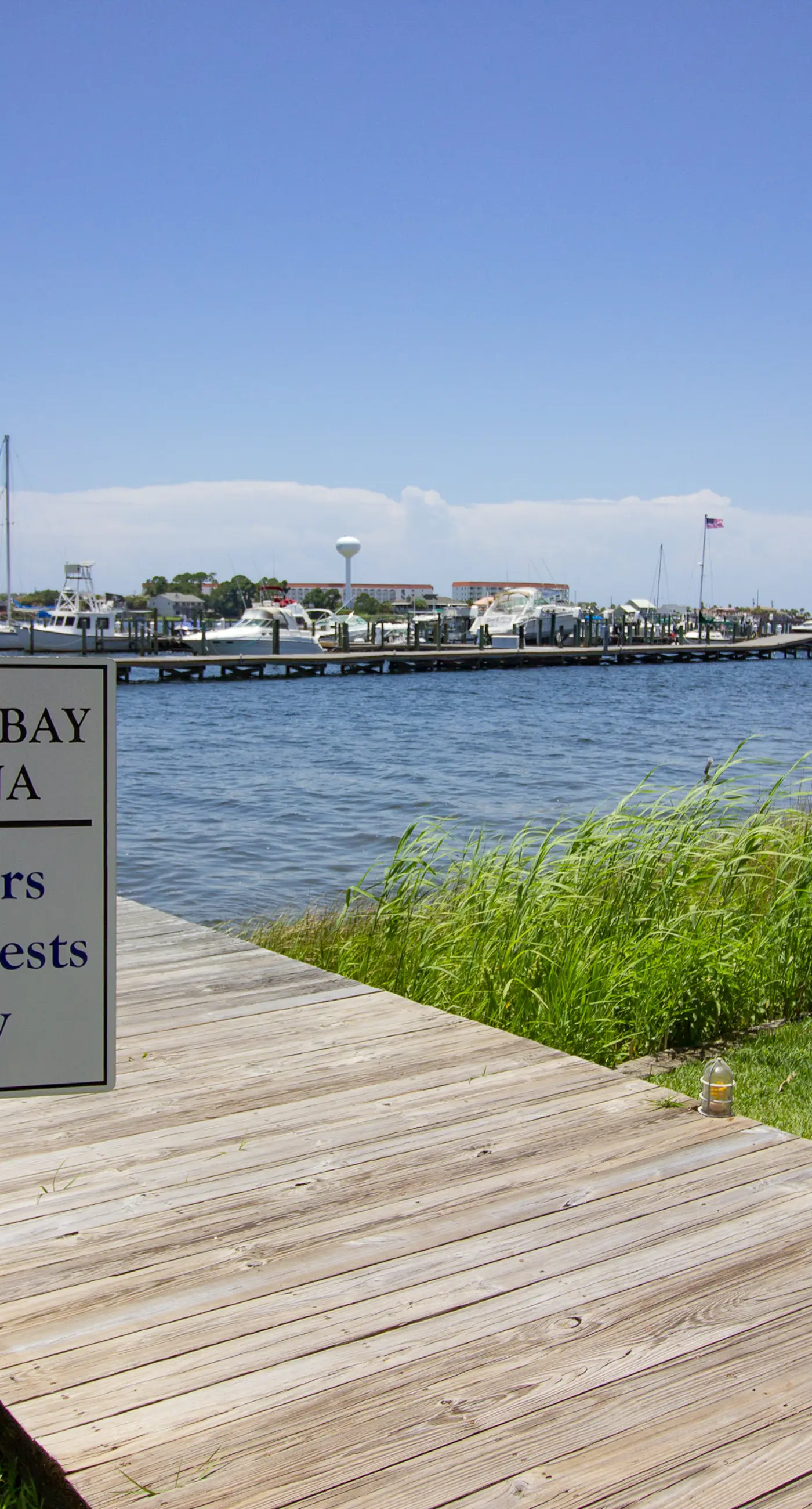 Inviting bayfront suite with water views, picnic area & pool