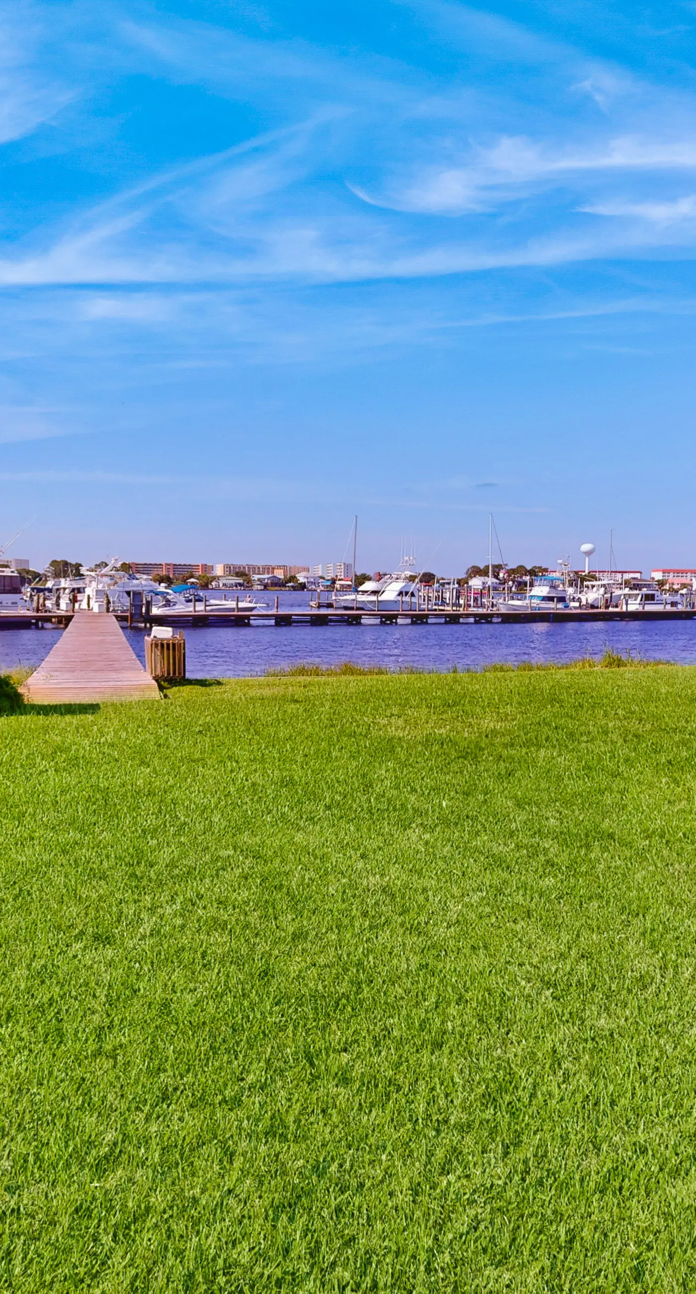 Inviting bayfront suite with water views, picnic area & pool