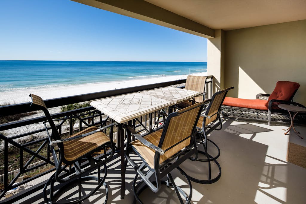 Gulf-view condo with beachfront access, pool, hot tub, gym, AC, & washer&dryer
