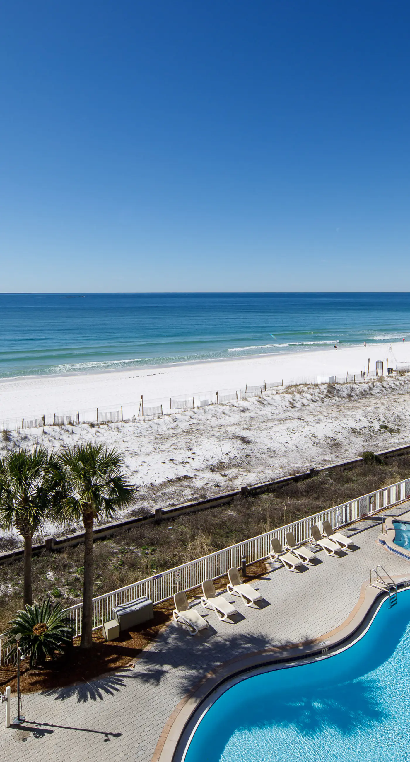 Gulf-view condo with beachfront access, pool, hot tub, gym, AC, & washer&dryer