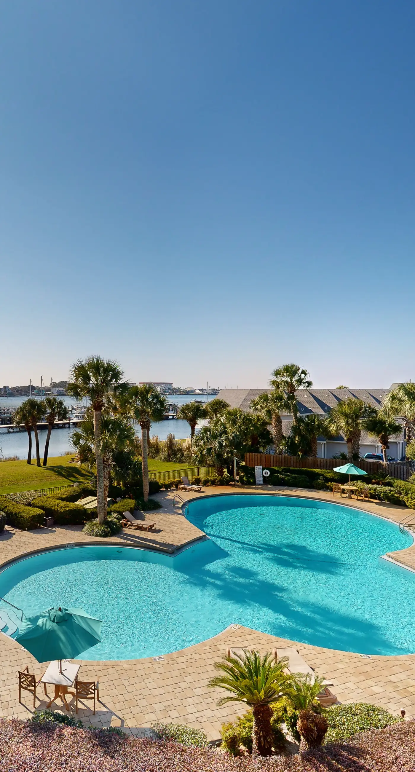 Cozy waterfront condo with central AC, beach access, on-site pool