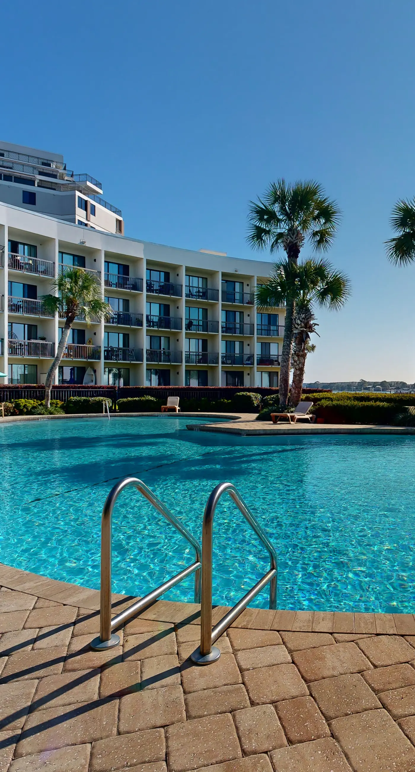 Cozy waterfront condo with central AC, beach access, on-site pool