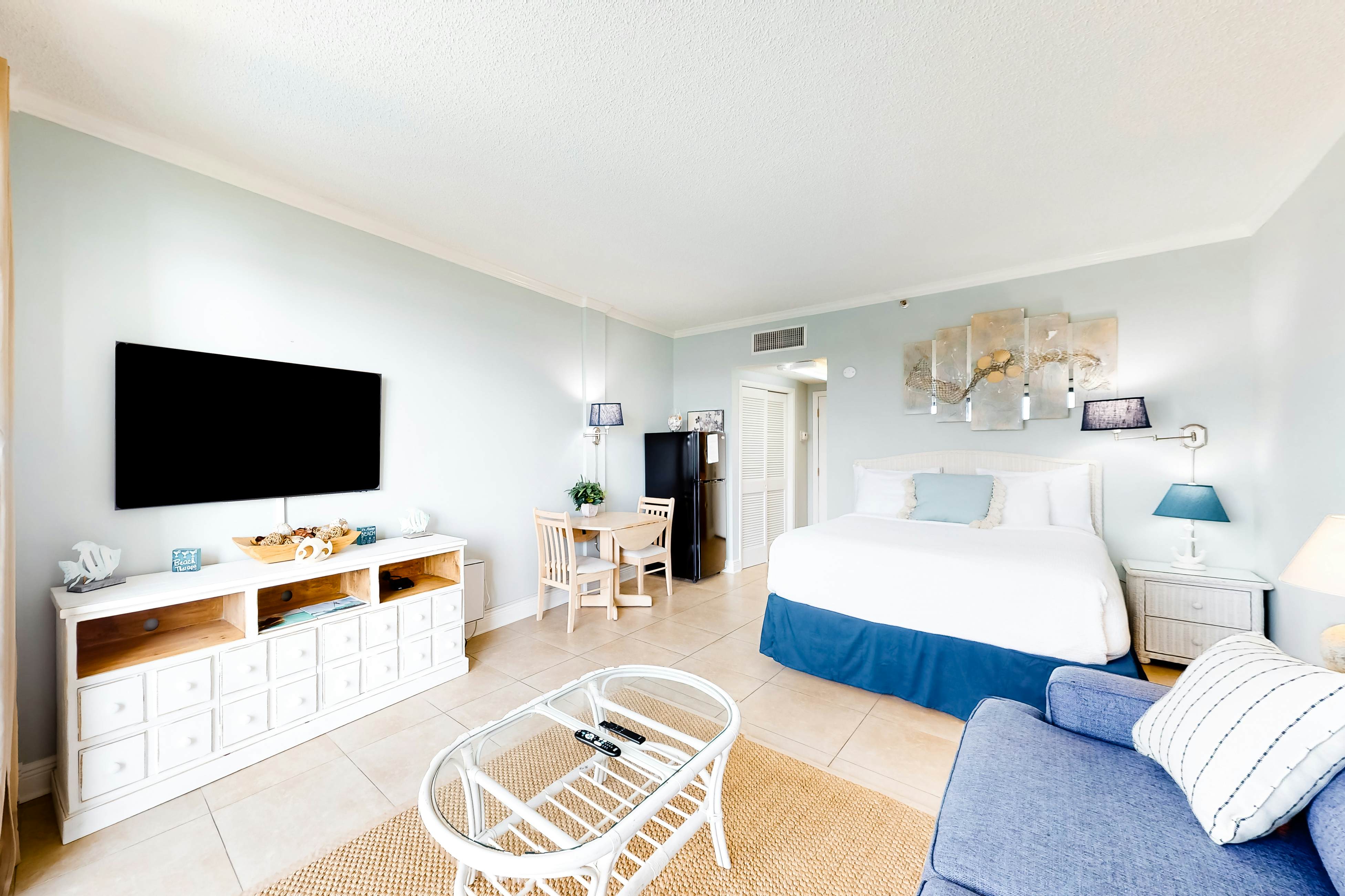 Cozy coastal efficiency with kitchenette, balcony with sound views & pool