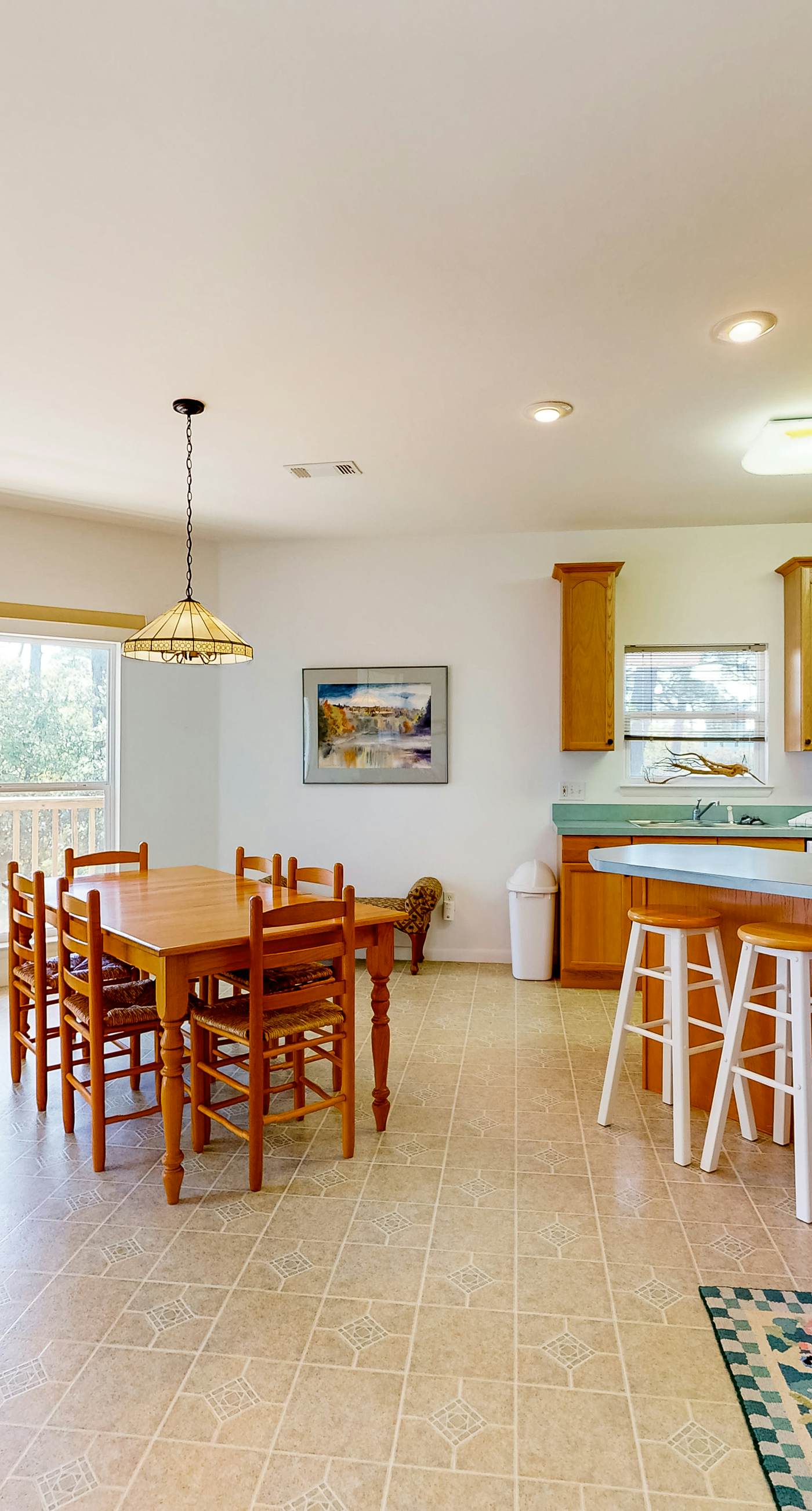 Snowbird-friendly home near the beach with deck, outdoor shower, W/D