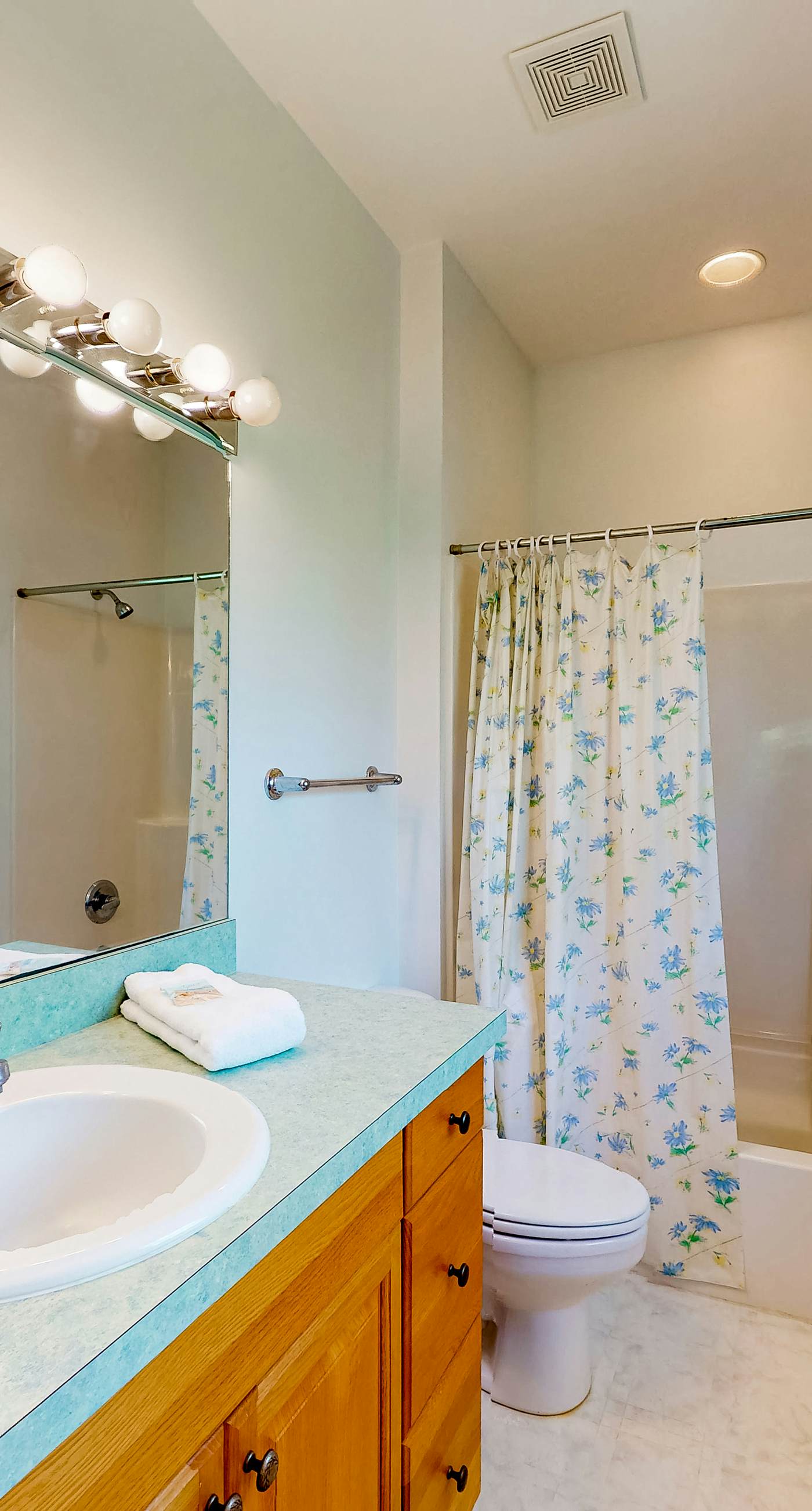 Snowbird-friendly home near the beach with deck, outdoor shower, W/D