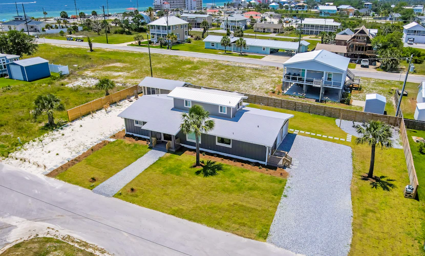 Remodeled home w/ firepit, kayak, SUPs & enclosed yard-1/2 block to beach