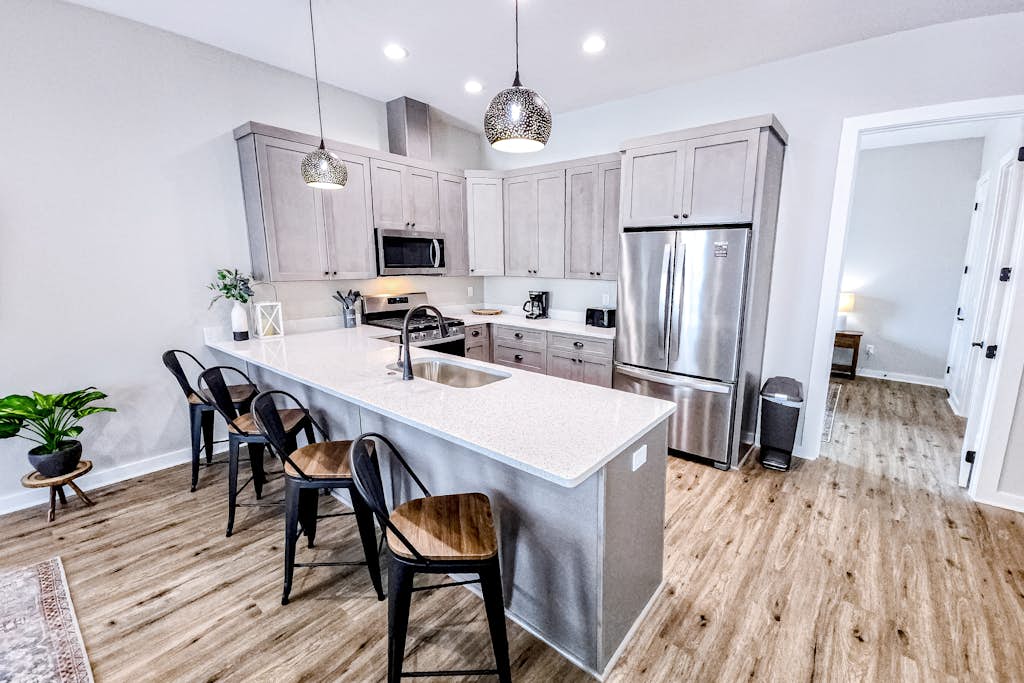 Dog-friendly home with two full kitchens, balcony, AC, washers & dryers