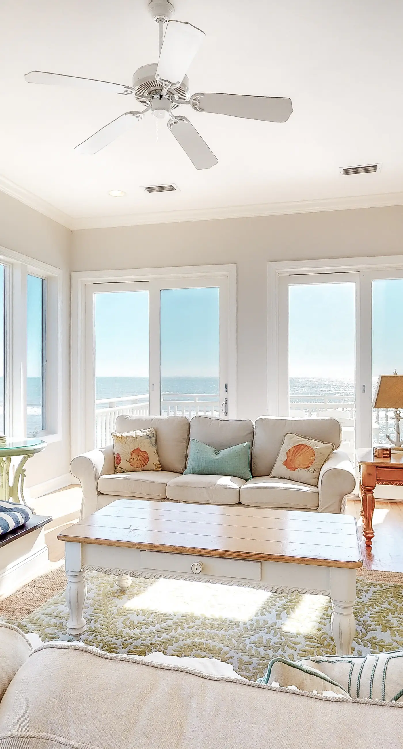 Beachfront home with a porch, washer/dryer, outdoor shower, & AC