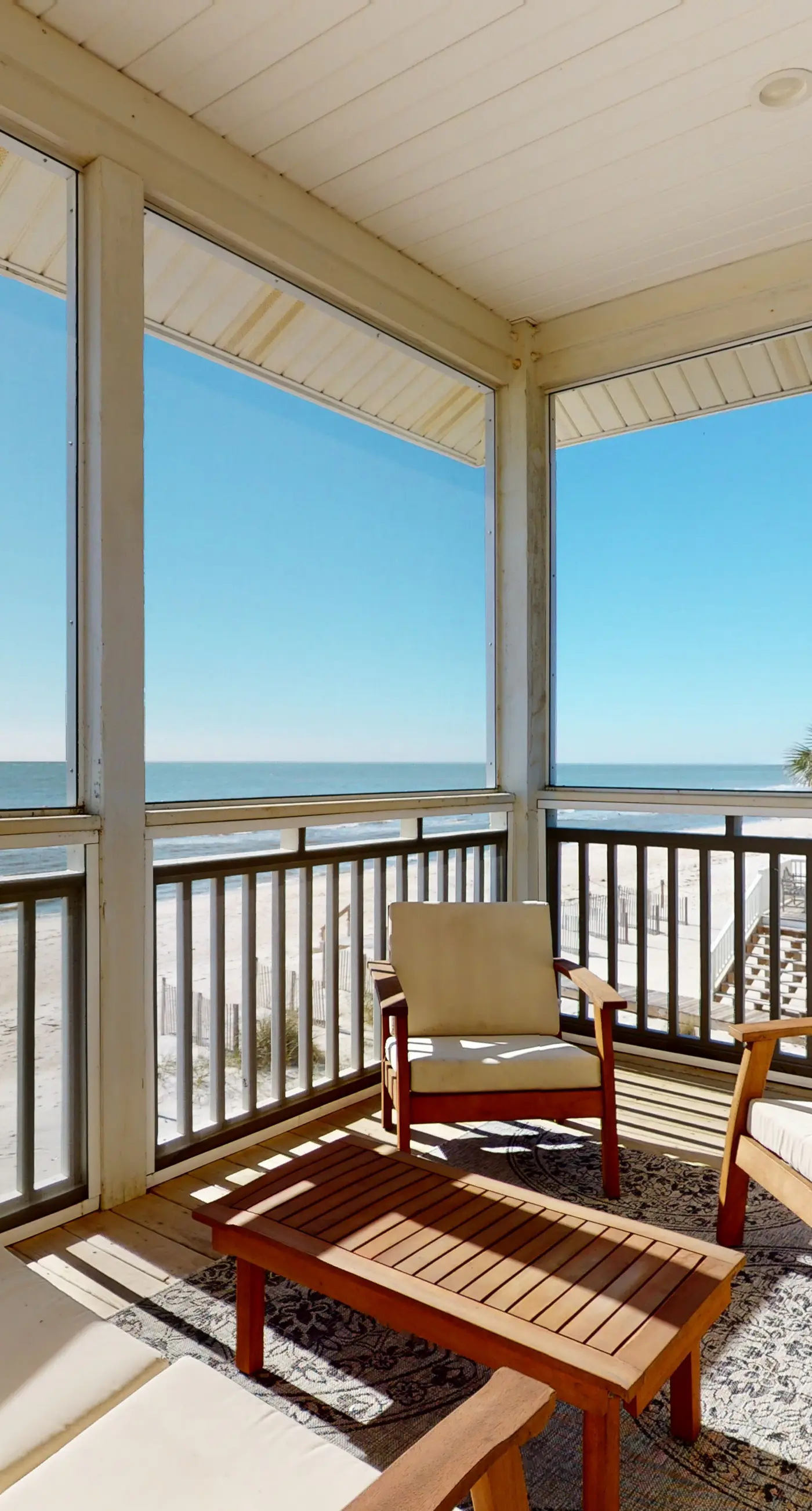 Beachfront home with a porch, washer/dryer, outdoor shower, & AC