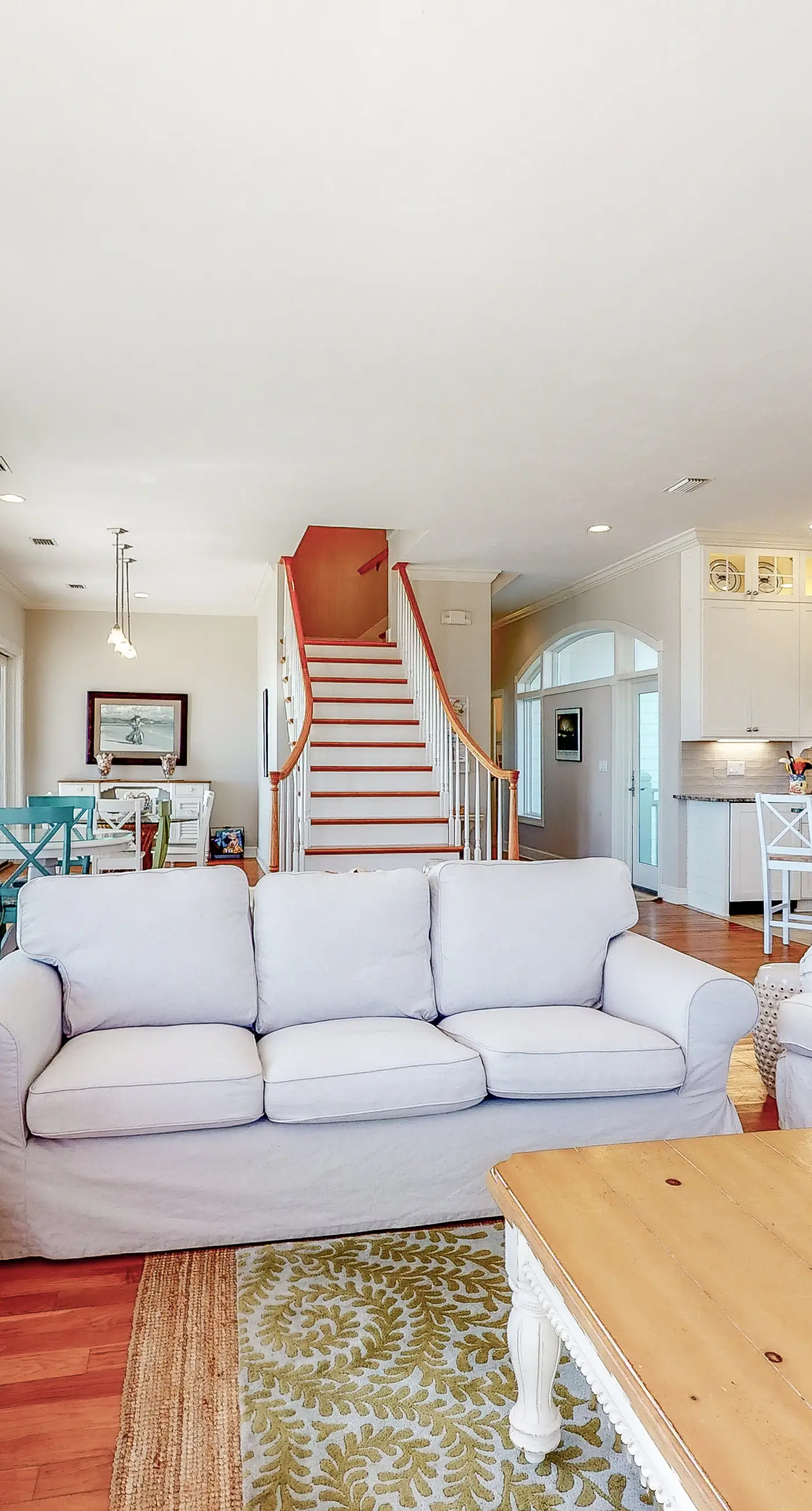 Beachfront home with a porch, washer/dryer, outdoor shower, & AC