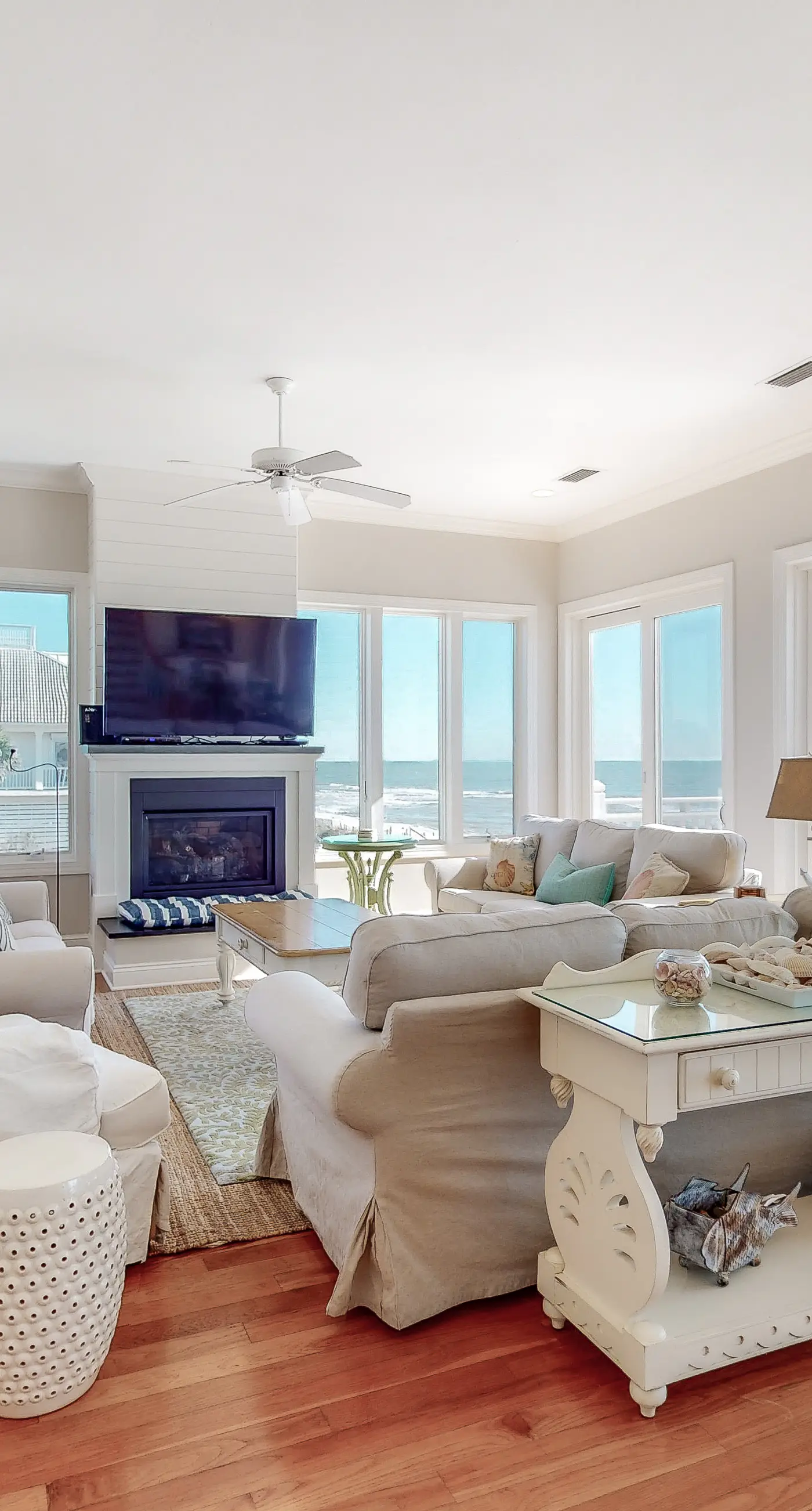 Beachfront home with a porch, washer/dryer, outdoor shower, & AC