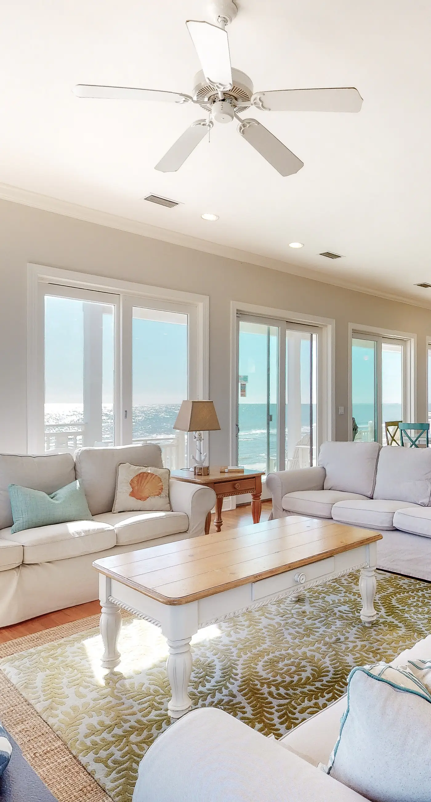 Beachfront home with a porch, washer/dryer, outdoor shower, & AC