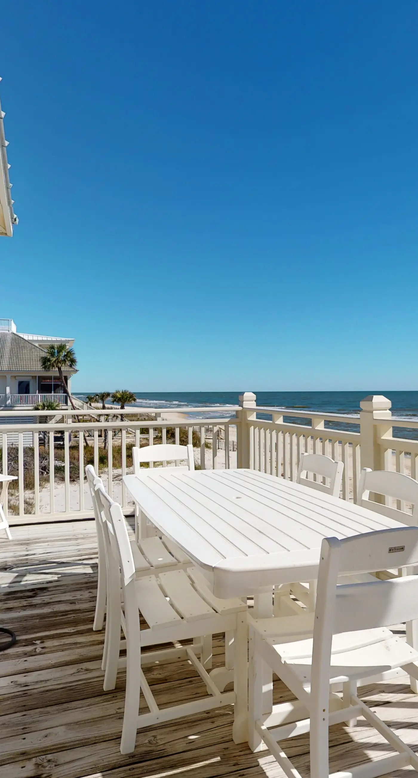 Beachfront home with a porch, washer/dryer, outdoor shower, & AC