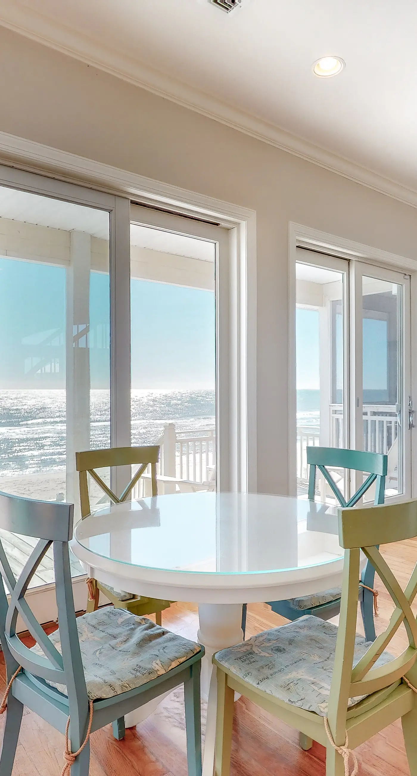 Beachfront home with a porch, washer/dryer, outdoor shower, & AC