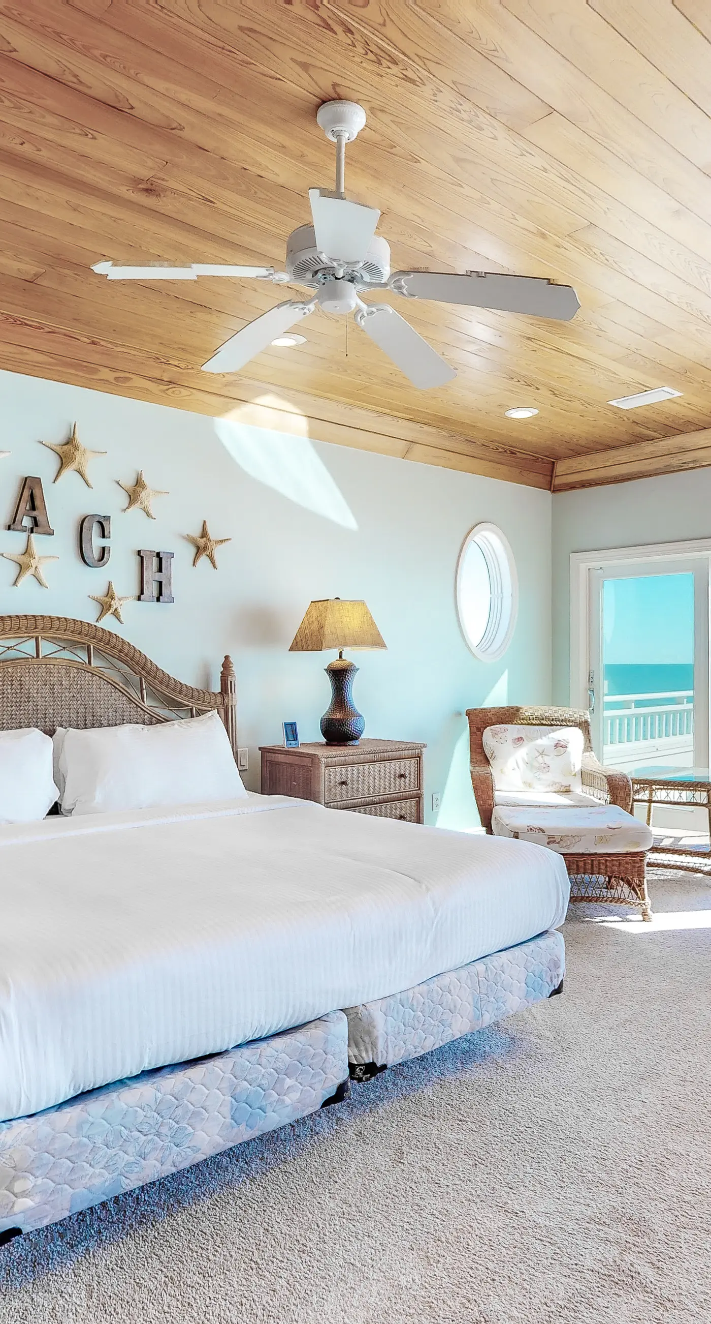 Beachfront home with a porch, washer/dryer, outdoor shower, & AC