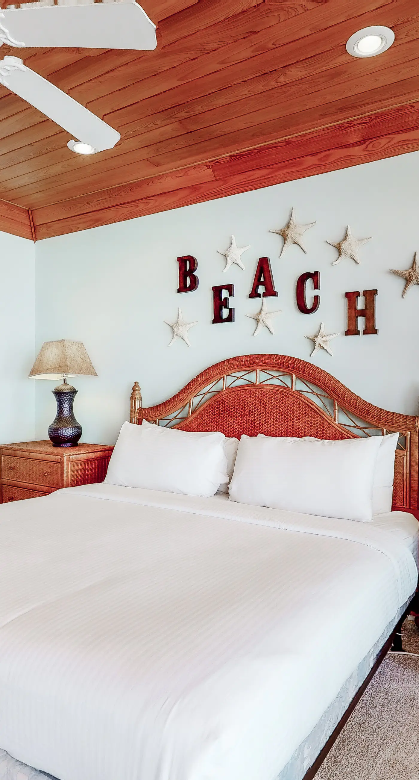 Beachfront home with a porch, washer/dryer, outdoor shower, & AC