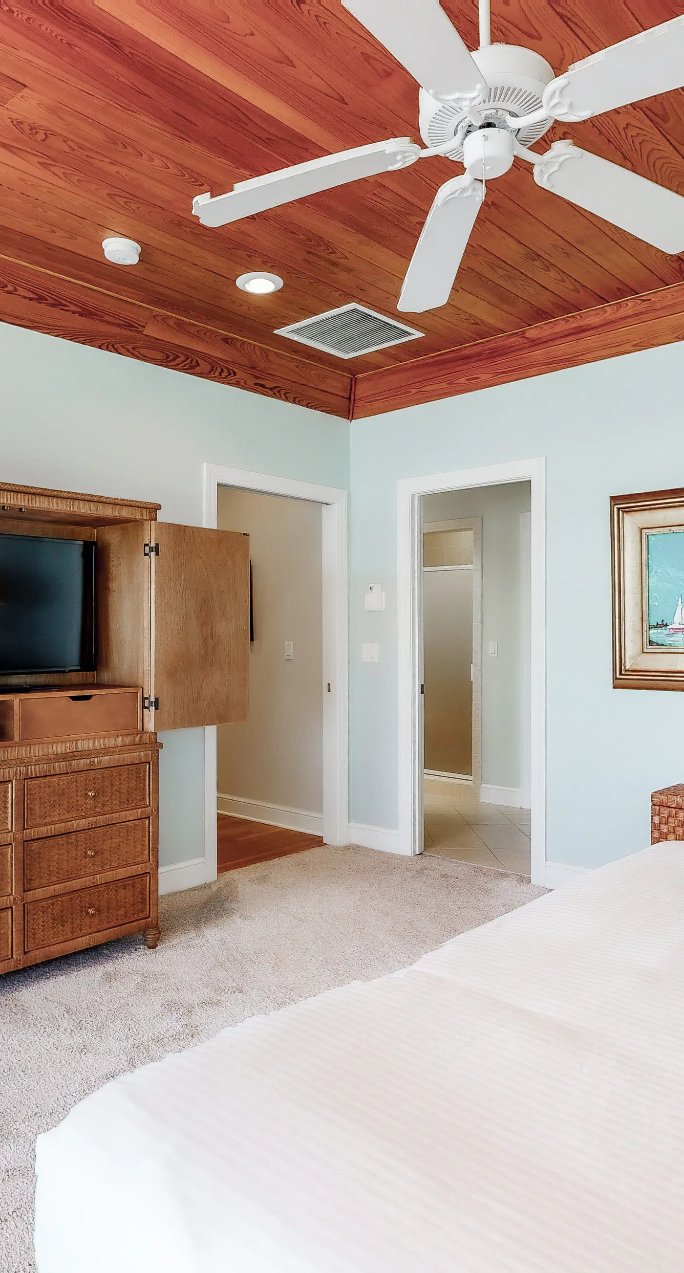 Beachfront home with a porch, washer/dryer, outdoor shower, & AC