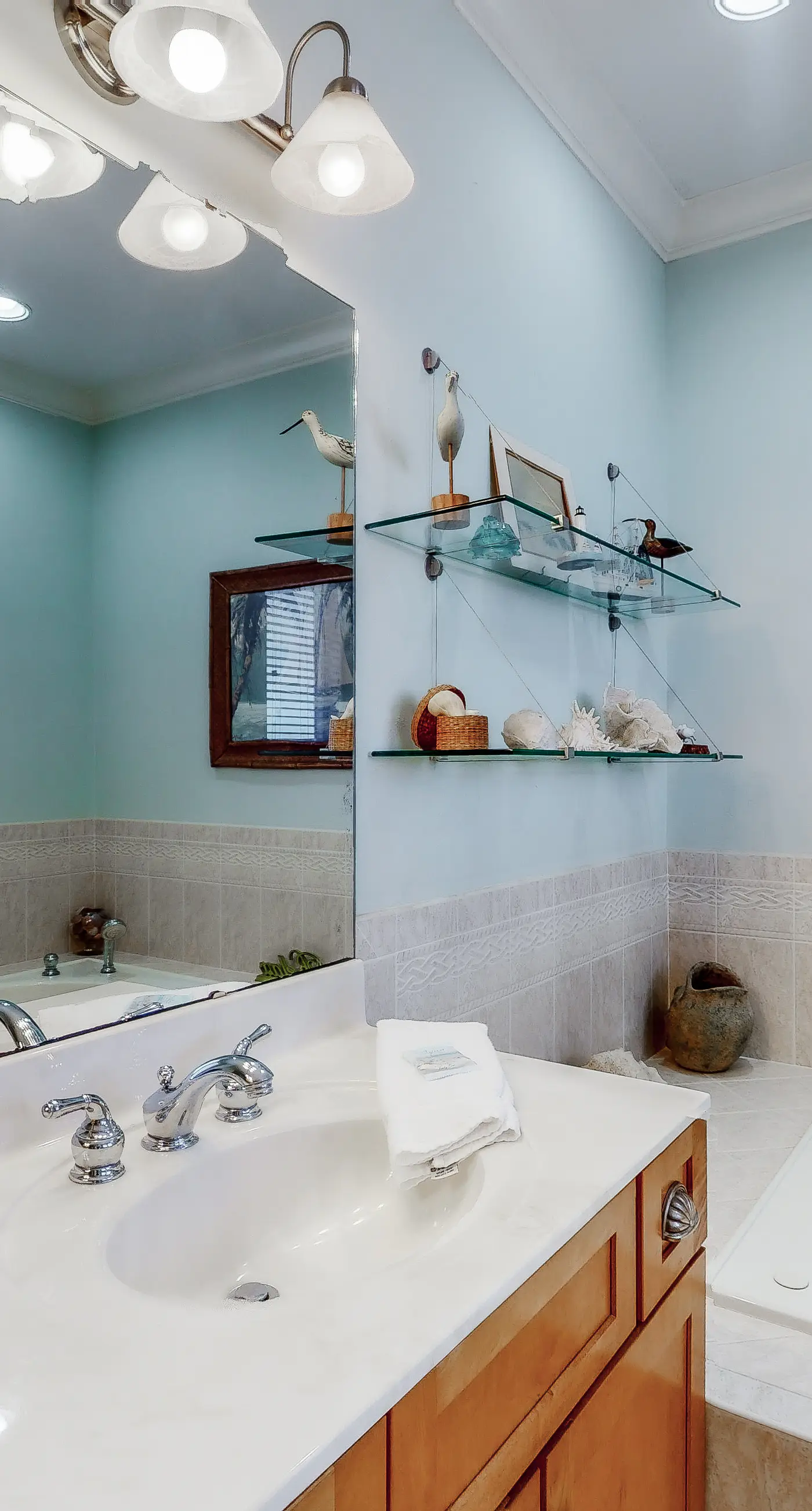 Beachfront home with a porch, washer/dryer, outdoor shower, & AC