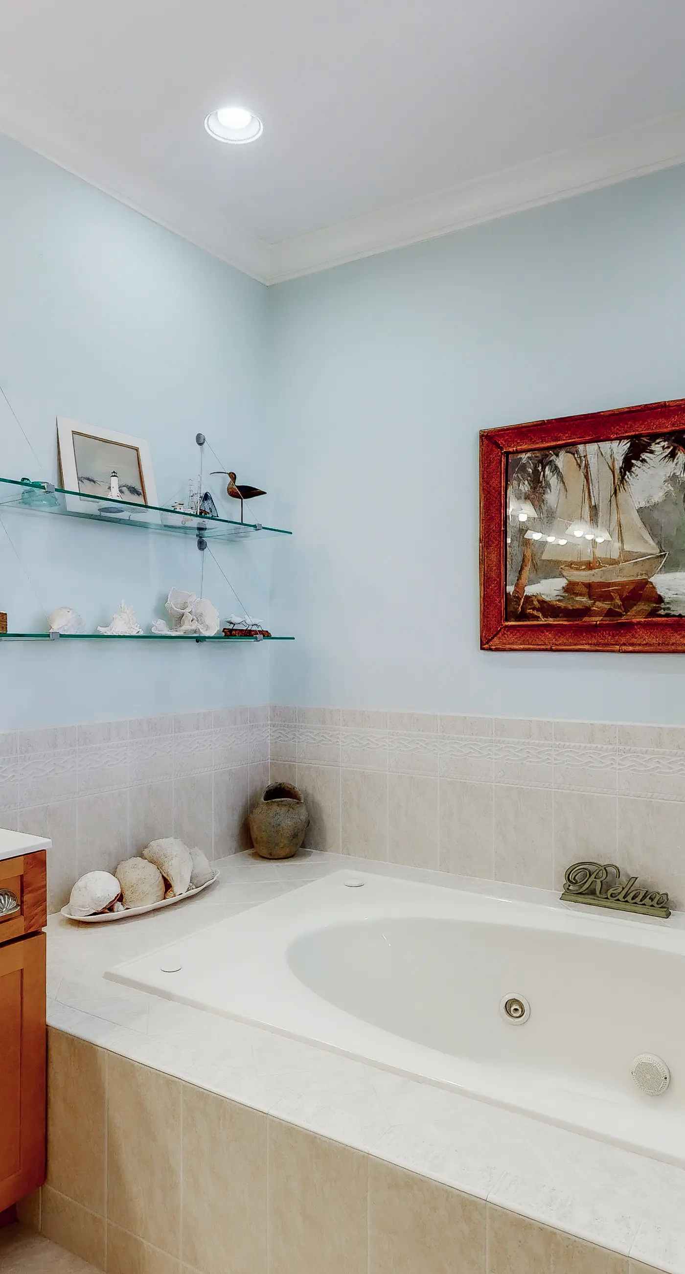 Beachfront home with a porch, washer/dryer, outdoor shower, & AC